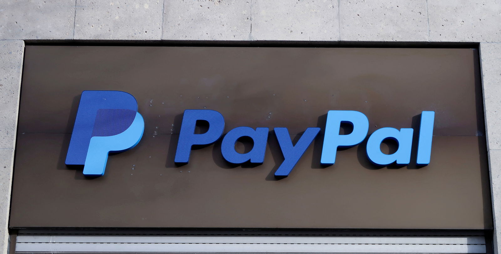 FILE PHOTO: The PayPal logo is seen at an office building in Berlin, Germany, March 5, 2019. REUTERS/Fabrizio Bensch