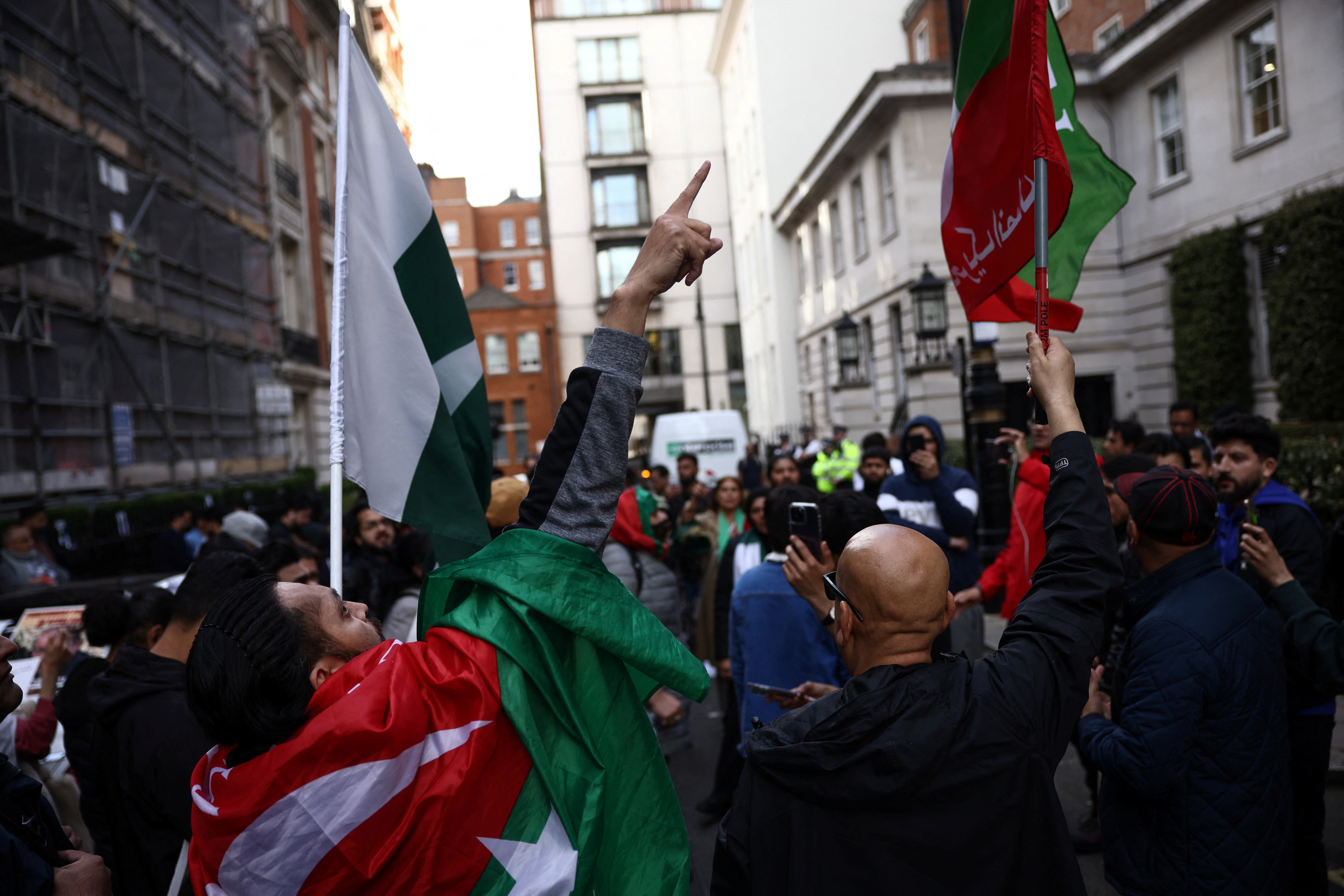 Supporters of Pakistan’s former Prime Minister Imran Khan protest against his arrest, outside Avenfield House, a residential building where former Pakistani Prime Minister Nawaz Sharif is reported to own a property in London, Britain May 10, 2023. REUTERS/Henry Nicholls