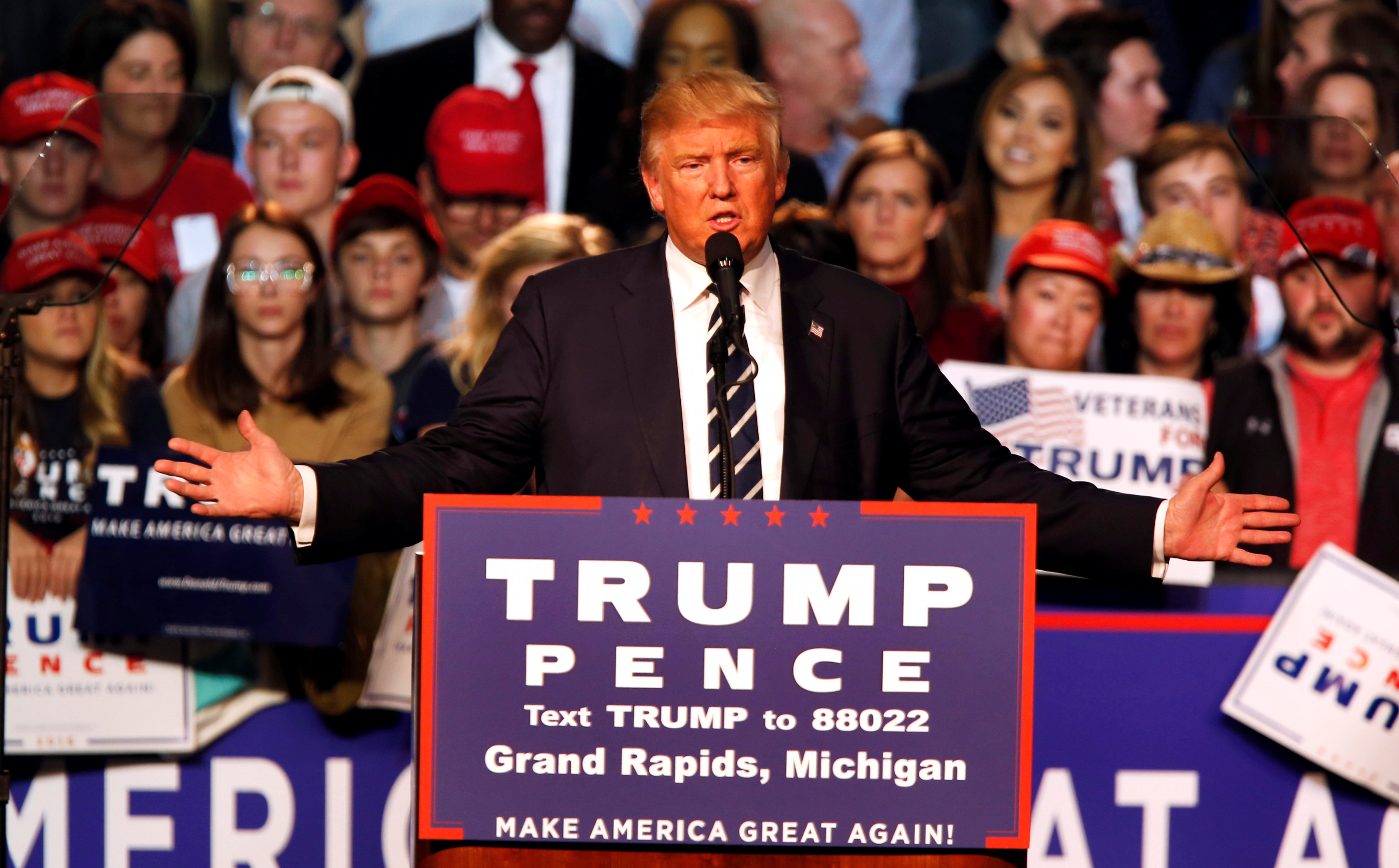 FILE PHOTO: U.S. Republican presidential nominee Donald Trump speaks at his final campaign event at the Devos Place in Grand Rapids, Michigan, U.S. November 8, 2016. REUTERS/Rebecca Cook
