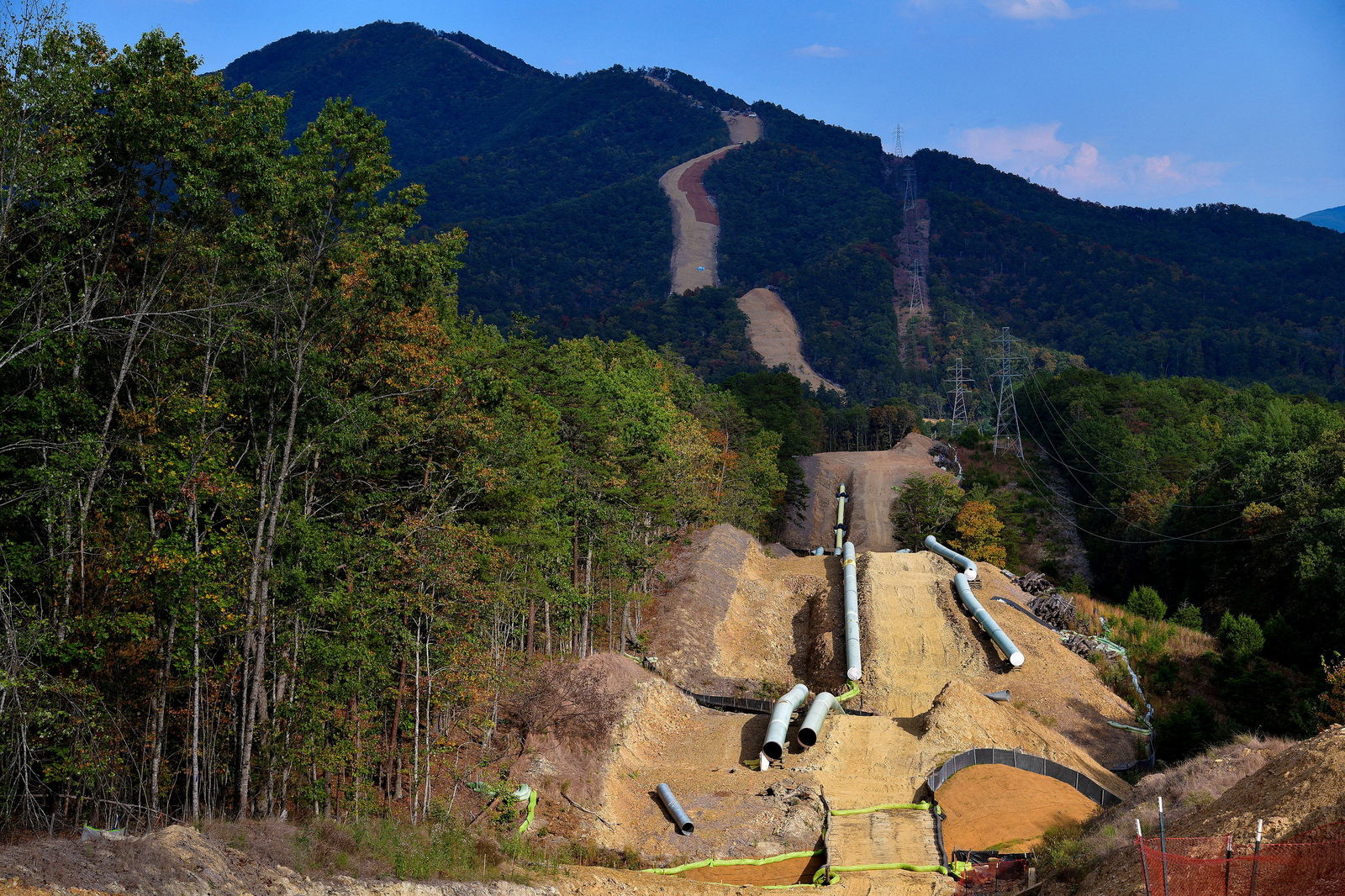 FILE PHOTO: Lengths of pipe wait to be laid in the ground along the under-construction Mountain Valley Pipeline near Elliston, Virginia, U.S. September 29, 2019. REUTERS/Charles Mostoller