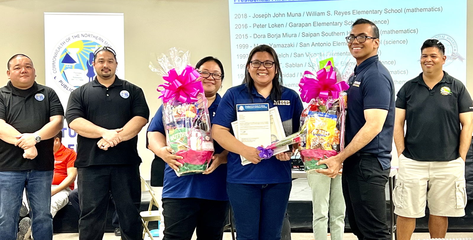 Marianas High School mathematics teacher Eden Mercado, 3rd right, smiles as she was honored by the Public School System for being one of the finalists in the 2023 Presidential Awards for Excellence in Mathematics and Science Teaching or PAEMST. Also in photo are acting Commissioner of Education Eric Magofna, MHS Principal Jonathan Aguon, acting PSS Finance and Budget Director Michael Babauta and 2022 PAEMST finalist Dr. Patrick Castillon.