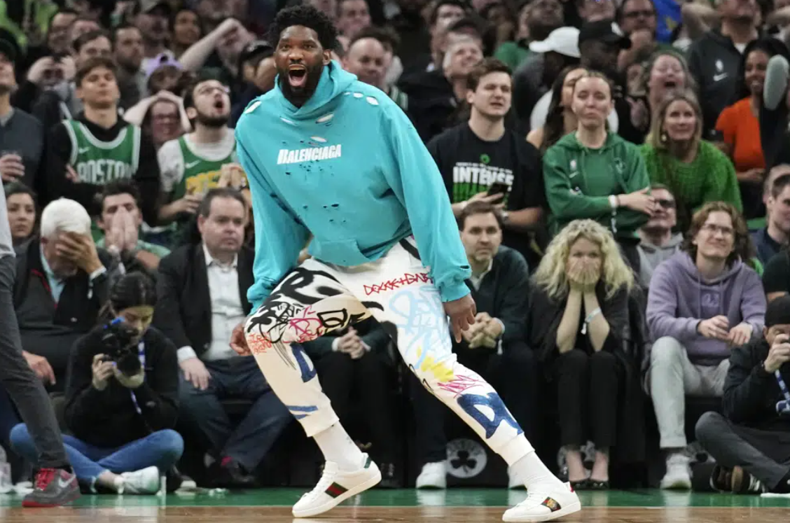 Philadelphia 76ers center Joel Embiid celebrates after a 3-point basket by James Harden during the final minute of Game 1 against the Boston Celtics in the NBA basketball Eastern Conference semifinals playoff series, Monday, May 1, 2023, in Boston.