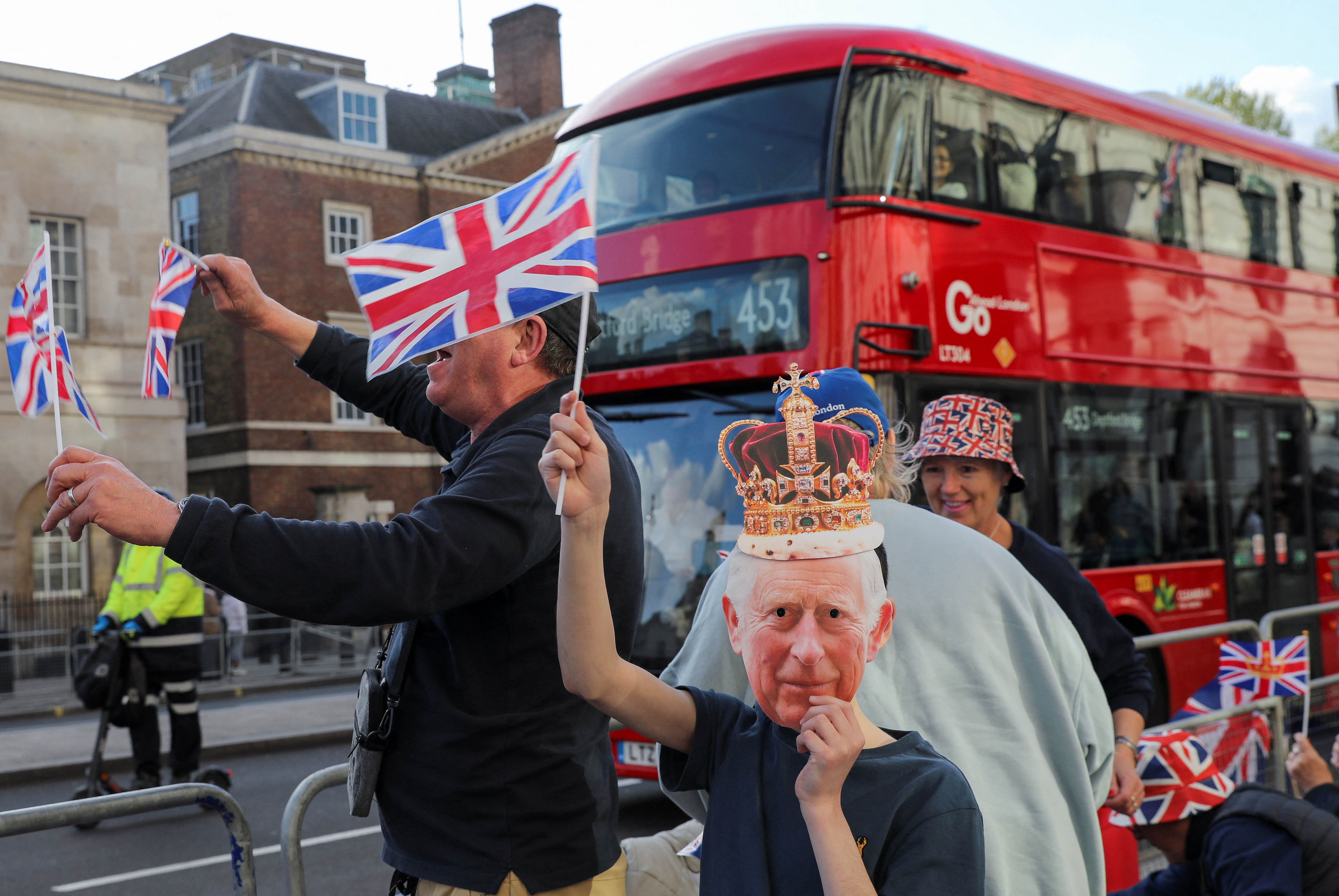 Well-wishers gather along the path that Britain's King Charles and Queen Consort Camilla will travel during the procession marking their coronation along the main streets of London, Britain, May 5, 2023. REUTERS/Violeta Santos Moura