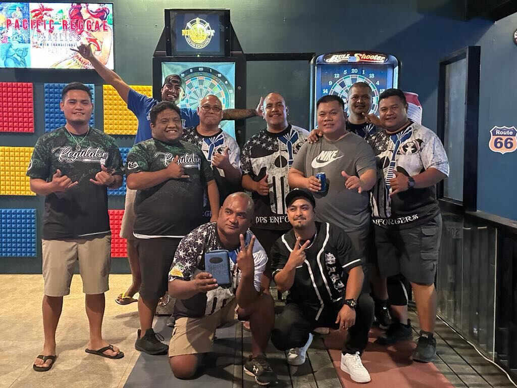 The Rendezvous Enforcers 1 and Black 8 EHDP Regulators pose for a photo after their game in the Inter-Government Division of the SEDA Bud Light Dart League on Friday at the Black 8 Pool Bar.