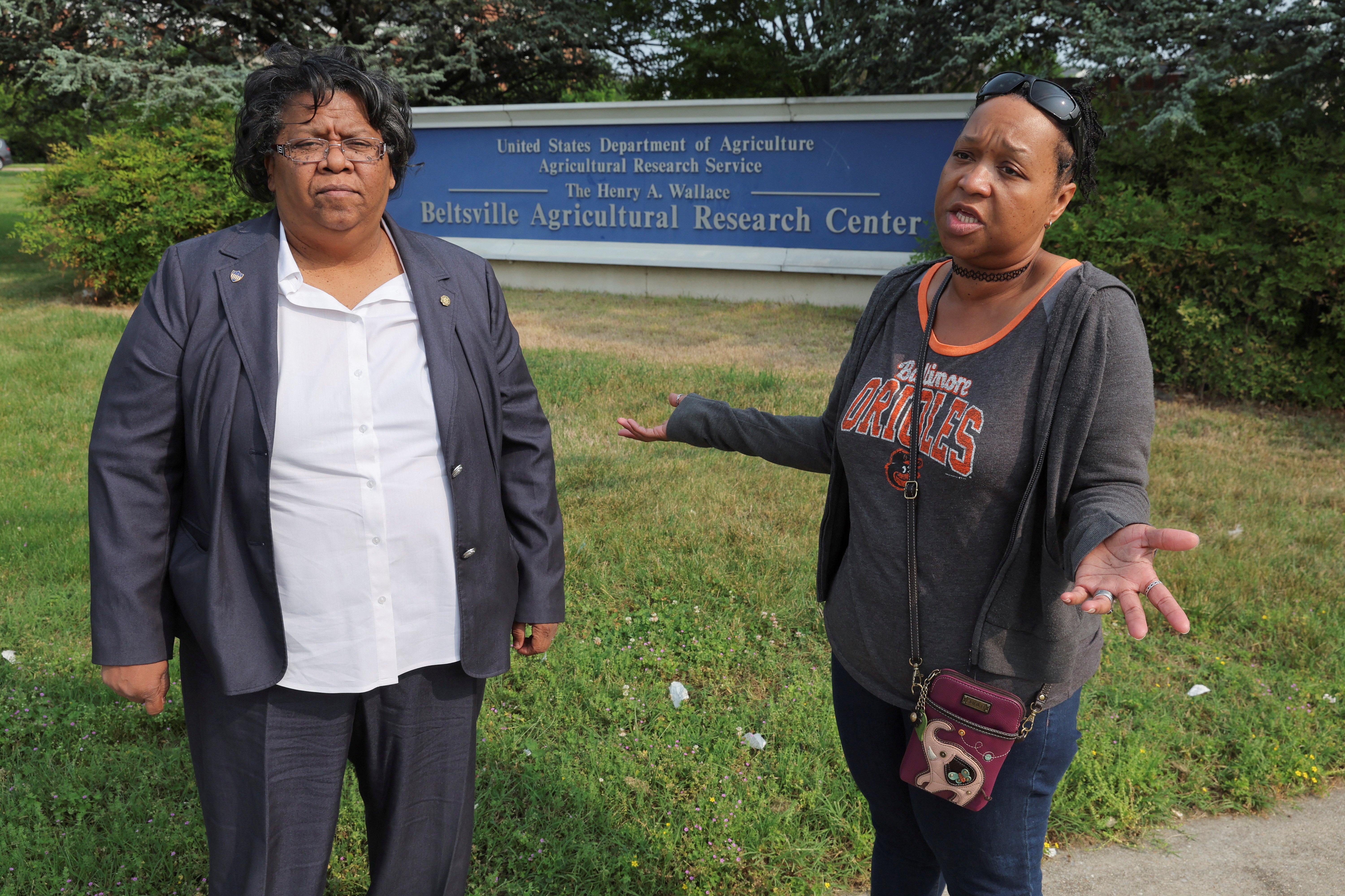 Claudette Joyner, president of the American Federation of Government Employees (AFGE) Local 3147 and a realty specialist at the U.S. Department of Agriculture’s (USDA) Beltsville Agricultural Research Center (BARC) and Ashaki "Teddi" Mitchell, vice-president of AFGE Local 3147 and a biological science laboratory technician at the same facility, talk to a reporter about an employee whistleblower complaint alleging unsafe work conditions for employees at the center as they stand outside the farm research facility in Beltsville, Maryland, U.S. May 17, 2023. REUTERS/Jim Bourg