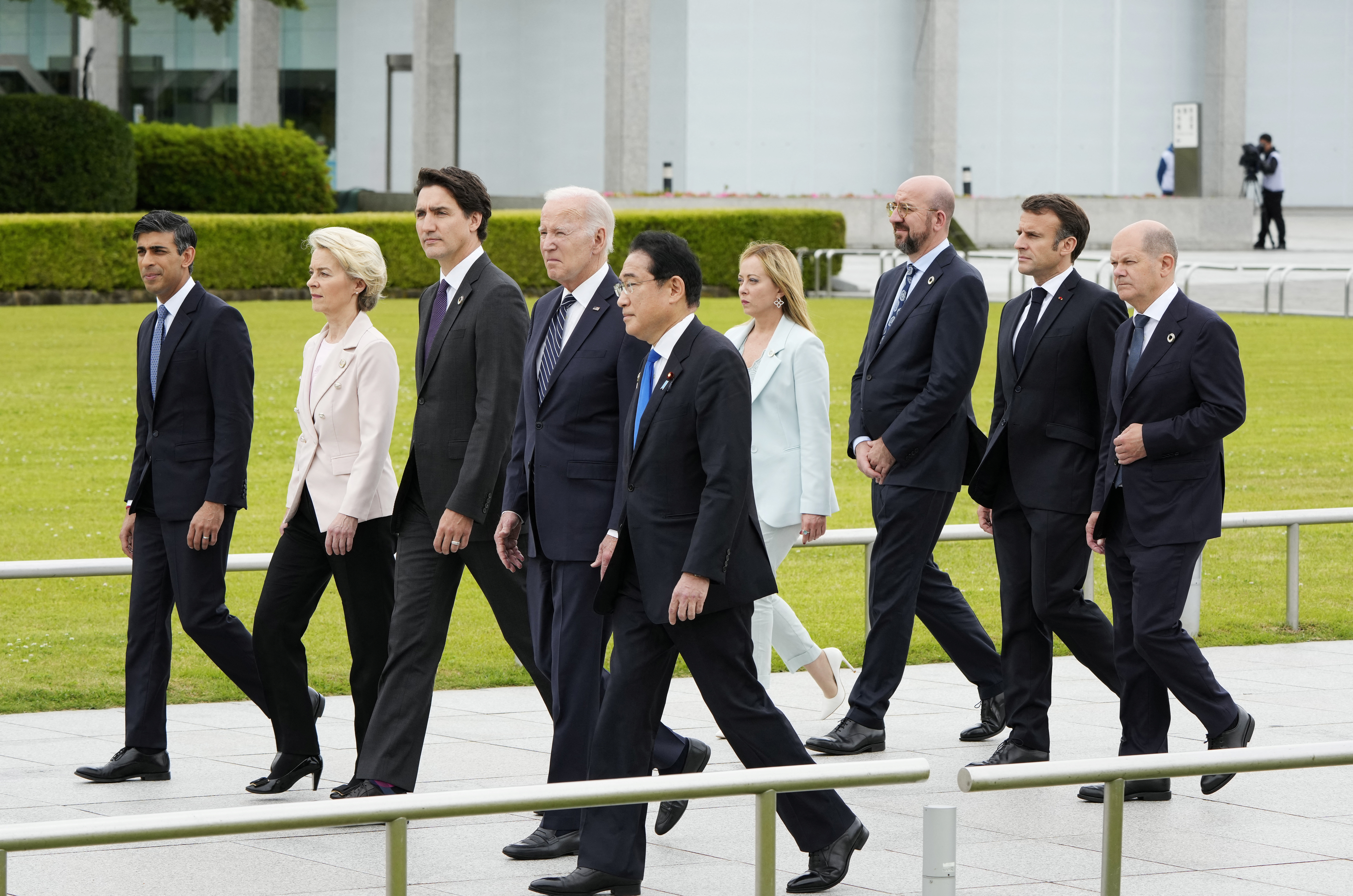 British Prime Minister Rishi Sunak, European Commission President Ursula von der Leyen, Canadian Prime Minister Justin Trudeau, US President Joe Biden, Japan’s Prime Minister Fumio Kishida, Italian Prime Minister Giorgia Meloni, European Council President Charles Michel, French President Emmanuel Macron, German Chancellor Olaf Scholz, walk to a flower wreath laying ceremony at the Cenotaph for Atomic Bomb Victims in the Peace Memorial Park as part of the G7 Hiroshima Summit in Hiroshima, Japan, 19 May 2023. The G7 Hiroshima Summit will be held from 19 to 21 May 2023. FRANCK ROBICHON/Pool via REUTERS