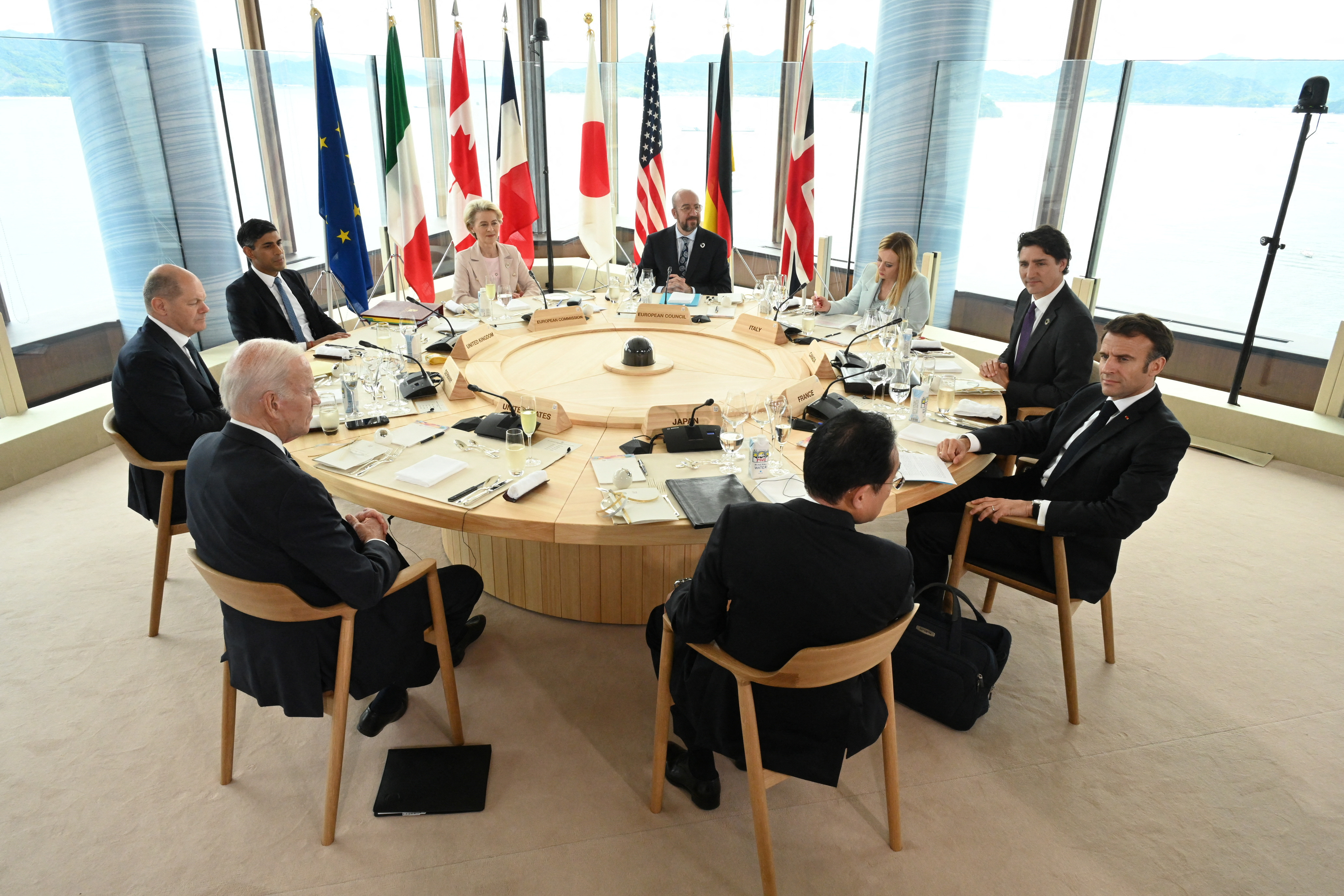 U.S. President Joe Biden, Germany's Chancellor Olaf Scholz, Britain's Prime Minister Rishi Sunak, European Commission President Ursula von der Leyen, President of the European Council Charles Michel, Italy's Prime Minister Giorgia Meloni, Canada's Prime Minister Justin Trudeau, France's President Emmanuel Macron and Japan's Prime Minister Fumio Kishida attend a working lunch meeting at G7 leaders' summit in Hiroshima