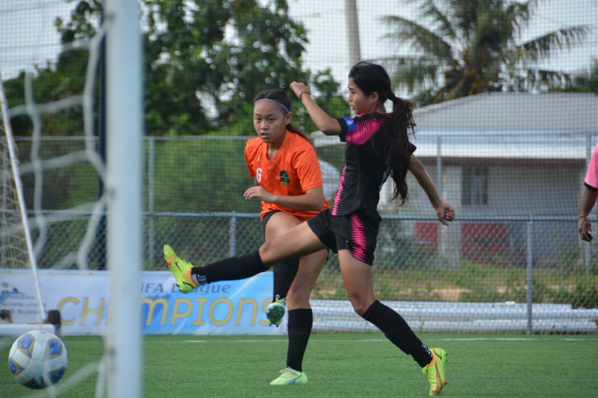 Kanoa’s Aubrey Castro takes the shot as a Southern United defender reaches in for the interception during the U17 girls division championship game of the TakeCare Youth Soccer League Saturday at the NMI Soccer Training Center in Koblerville.