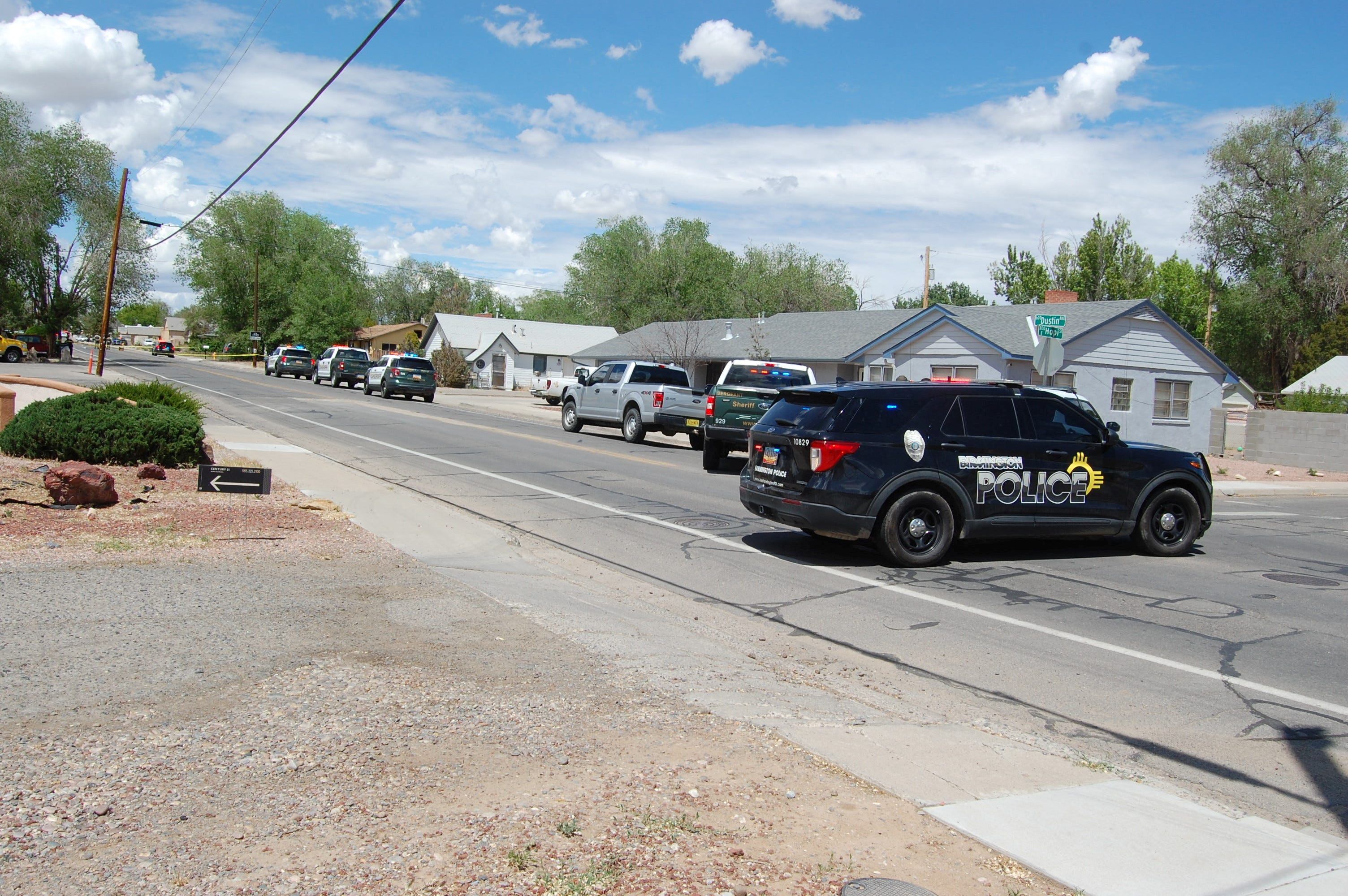 Law enforcement officers from the Farmington Police Department, San Juan County Sheriff's Office and New Mexico State Police deploy at the scene of a fatal shooting in Farmington, New Mexico, U.S. May 15, 2023. Mike Easterling/USA Today Network via REUTERS