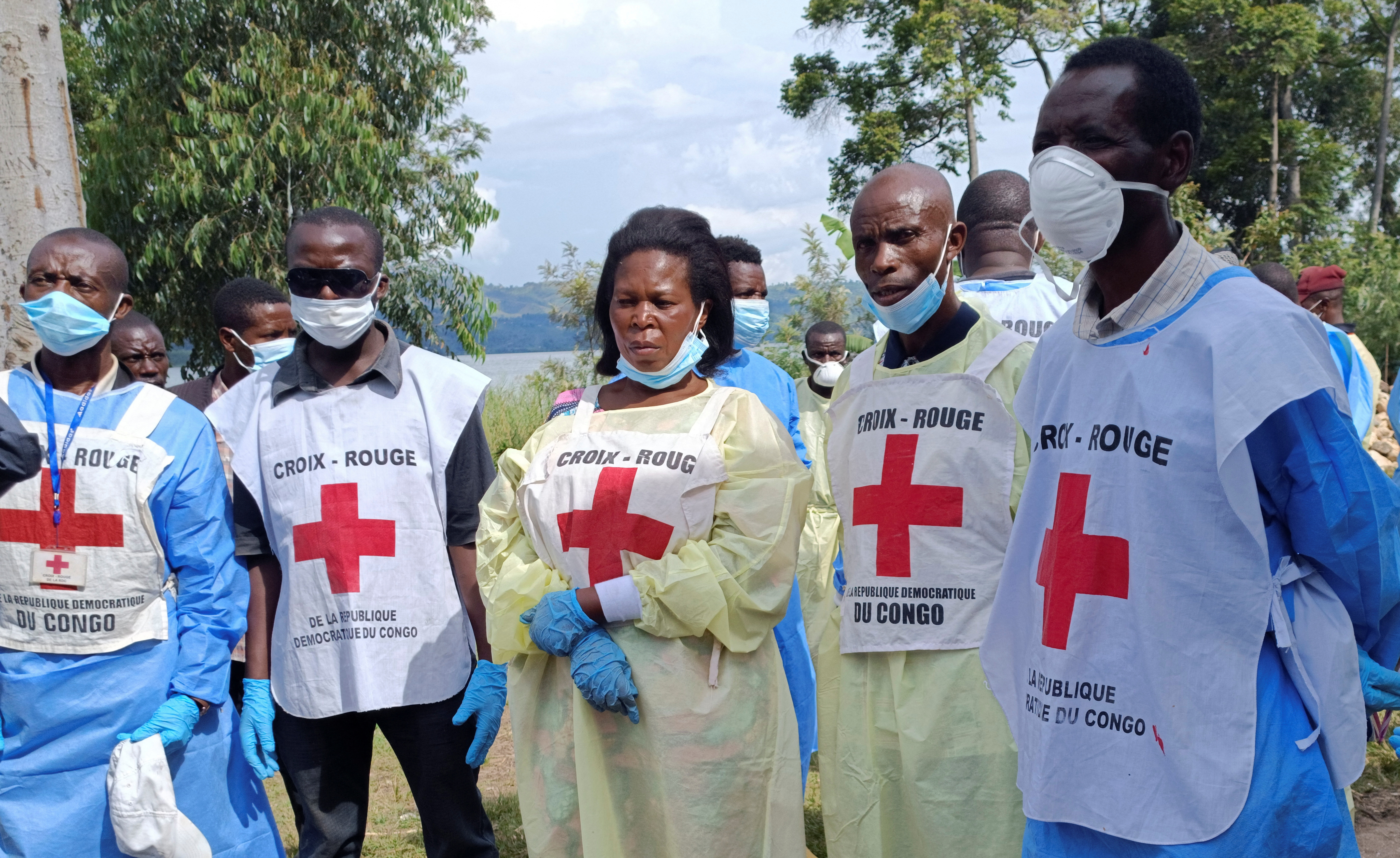 Red Cross workers and volunteers gather for a briefing where Congolese civilians were killed following rains that destroyed the remote, mountainous area and ripped through the riverside villages of Nyamukubi, Kalehe territory in South Kivu province of the Democratic Republic of Congo May 9, 2023. REUTERS/Djaffar Sabiti