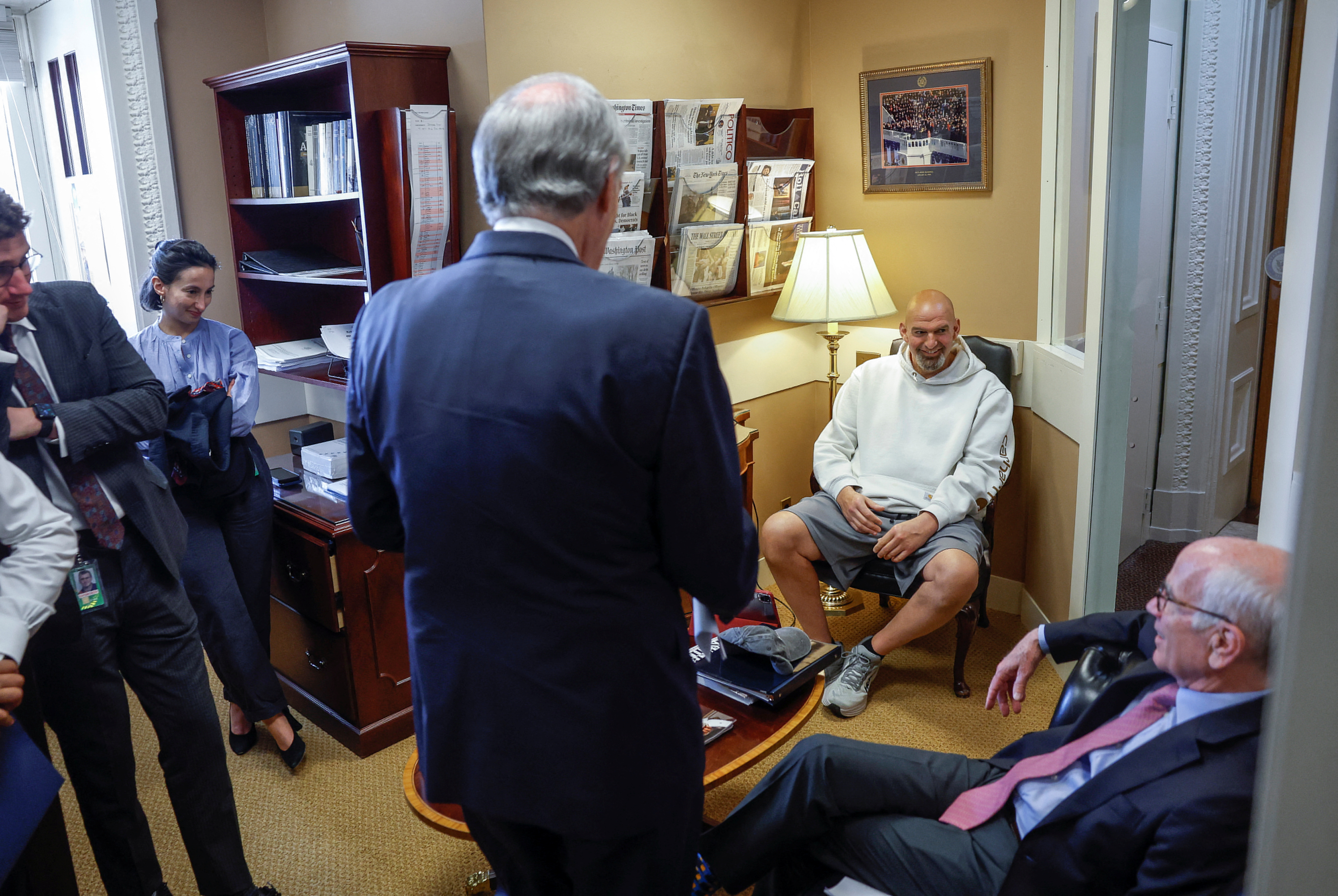 U.S. Senators John Fetterman (D-PA), Peter Welch (D-VT), and Edward Markey (D-MA) chat before a press conference on Capitol Hill about 11 Senate Democrats who sent a letter to President Joe Biden urging him to invoke the 14th Amendment to avoid a catastrophic debt default, in Washington, U.S., May 18, 2023. REUTERS/Evelyn Hockstein