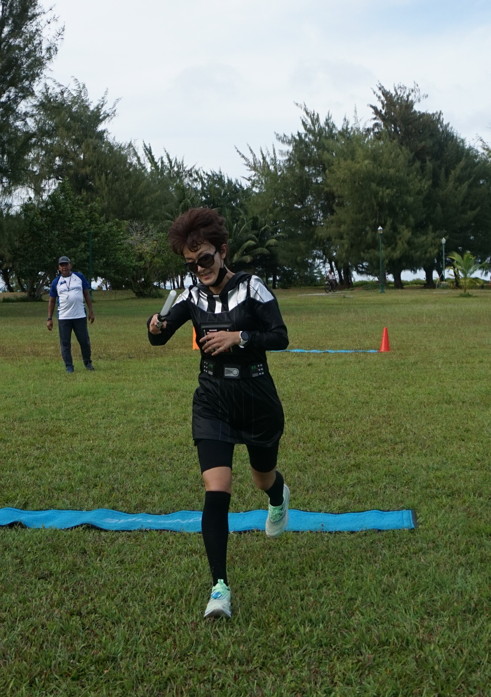 Ann Bang, dressed as Darth Vader, finishes first in the women's division of the SIS & Run Saipan’s 3rd Annual Star Wars Day run Saturday  at  Micro Beach.