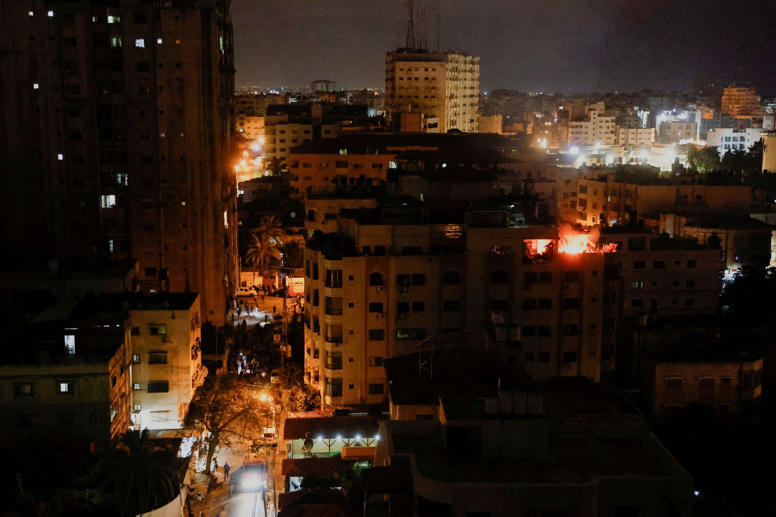 A fire burns in a building after the Israeli military struck Islamic Jihad targets, it said in a statement, in Gaza, May 9, 2023. REUTERS/Mohammed Salem