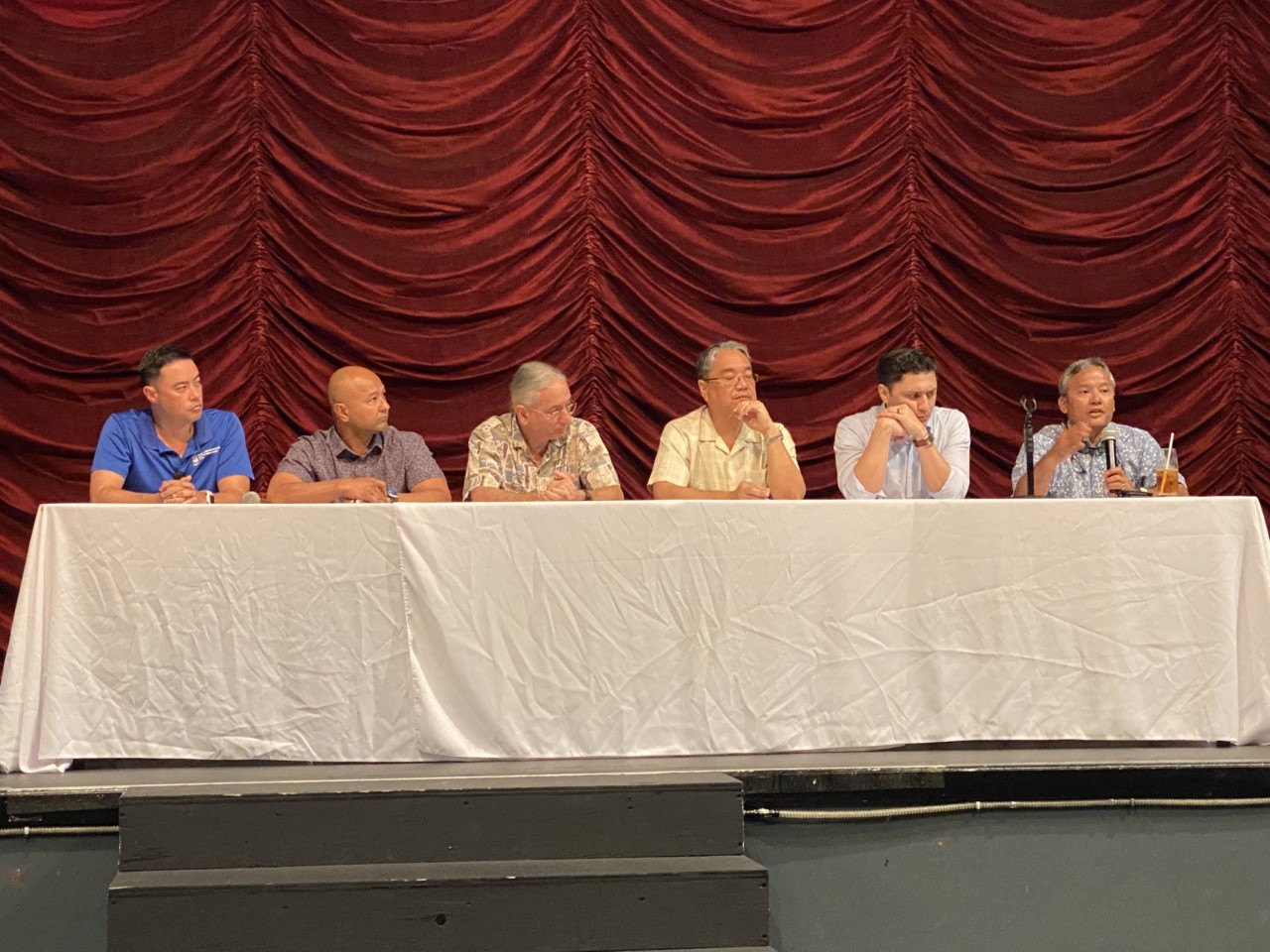From left, Joshua Wise, Saipan Chamber of Commerce vice president; Joe Guerrero, chamber president; Ron Smith, chamber director; Frank Ada, vice president of the Society for Human Resource Management-CNMI chapter;  Matt Deleon Guerrero, economist; and Alex Sablan, chamber director during a panel discussion on Wednesday at the Hyatt ballroom.