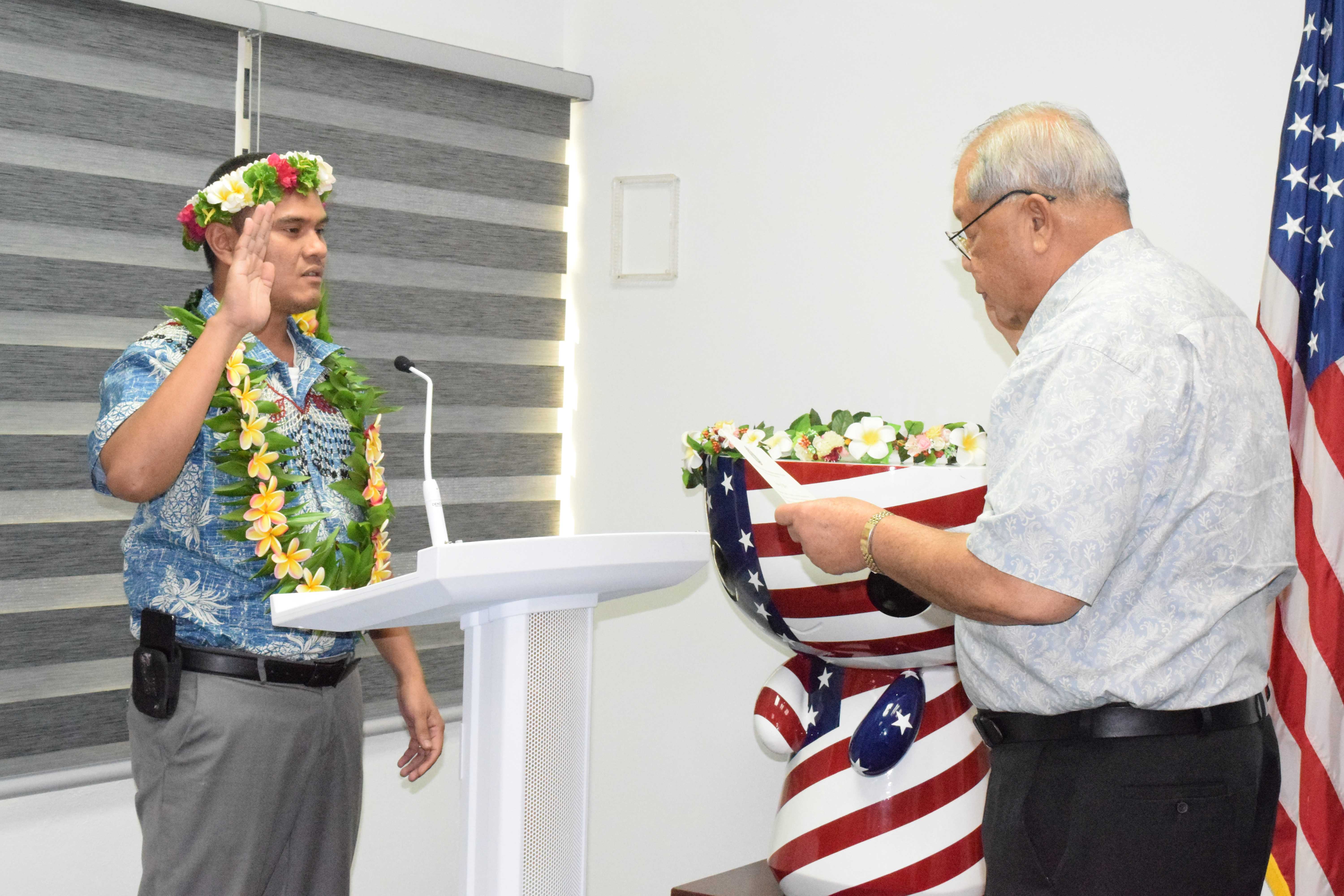 Acting Gov. David M. Apatang swears in CNMI Cannabis Commissioner Juan T. Iguel.