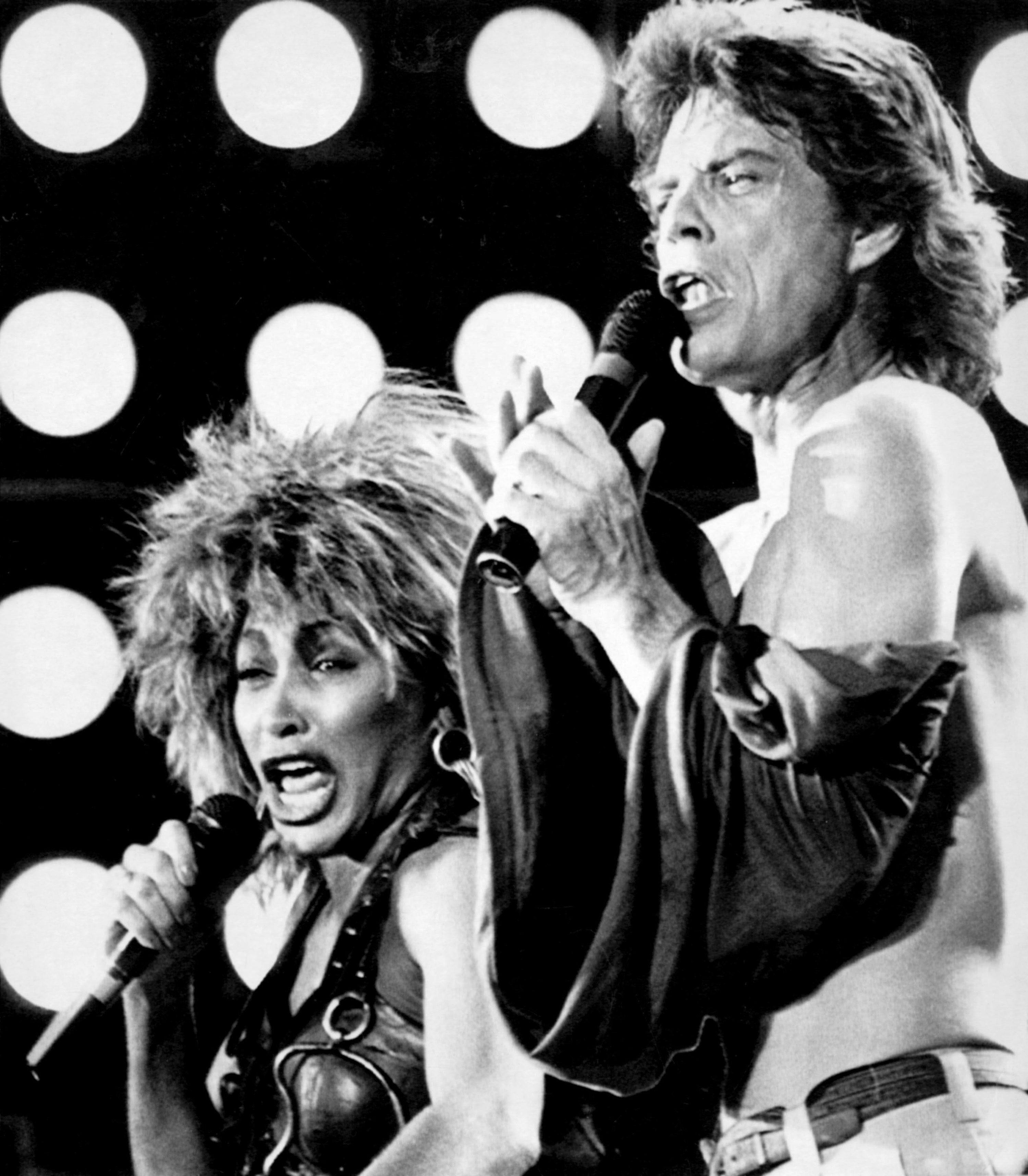 Tina Turner, left, and Mick Jagger perform at John F. Kennedy Stadium during the Live Aid concert in Philadelphia on July 13, 1985. (Starstock/Photoshot/UPPA/Zuma Press Wire/TNS)