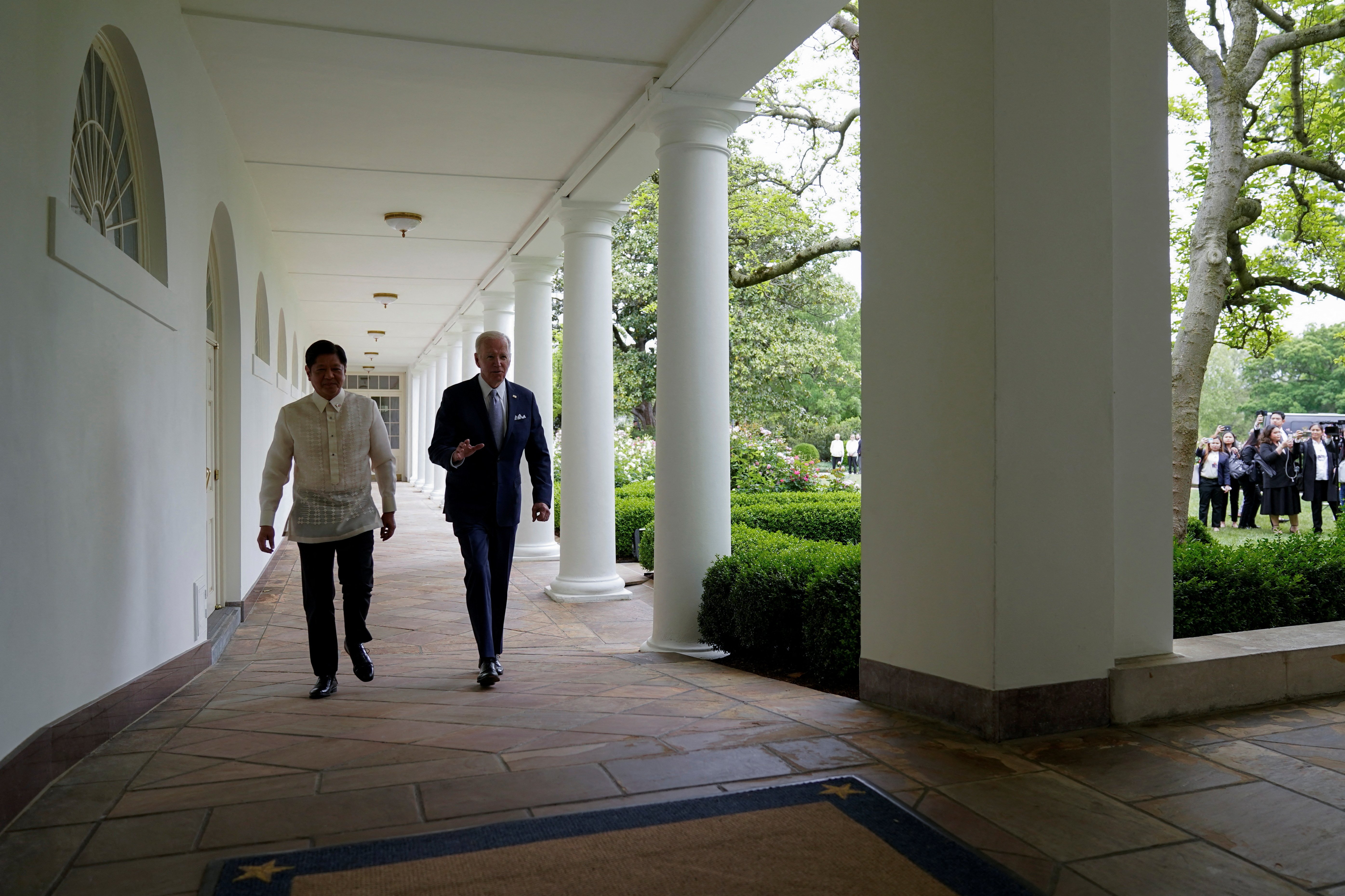 U.S. President Joe Biden and Philippines President Ferdinand Marcos Jr. walk on the West Colonnade to the Oval Office following a welcome ceremony at the White House in Washington, U.S., May 1, 2023. Carolyn Kaster/Pool via REUTERS