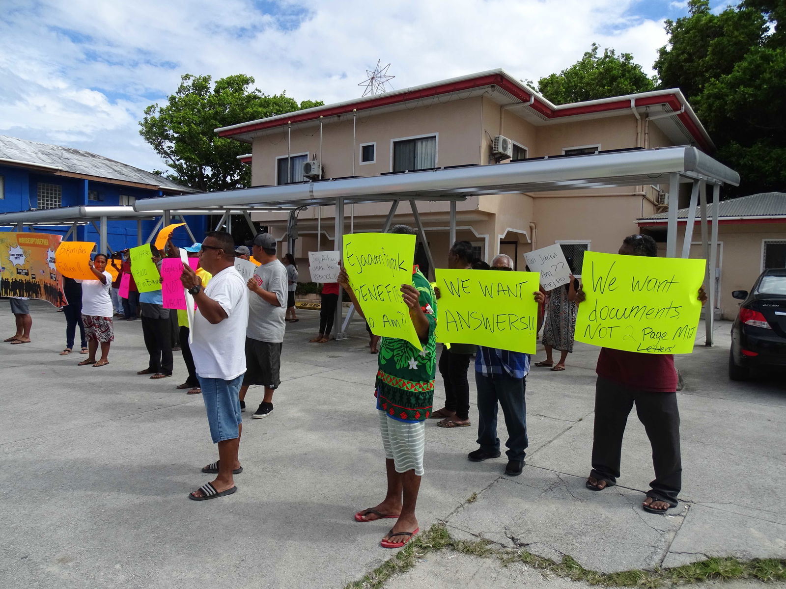Bikini islanders demonstrate outside their local government town hall in Majuro calling for investigation into leaders' spending that has exhausted a trust fund that provided aid to the displaced community for over 40 years.
