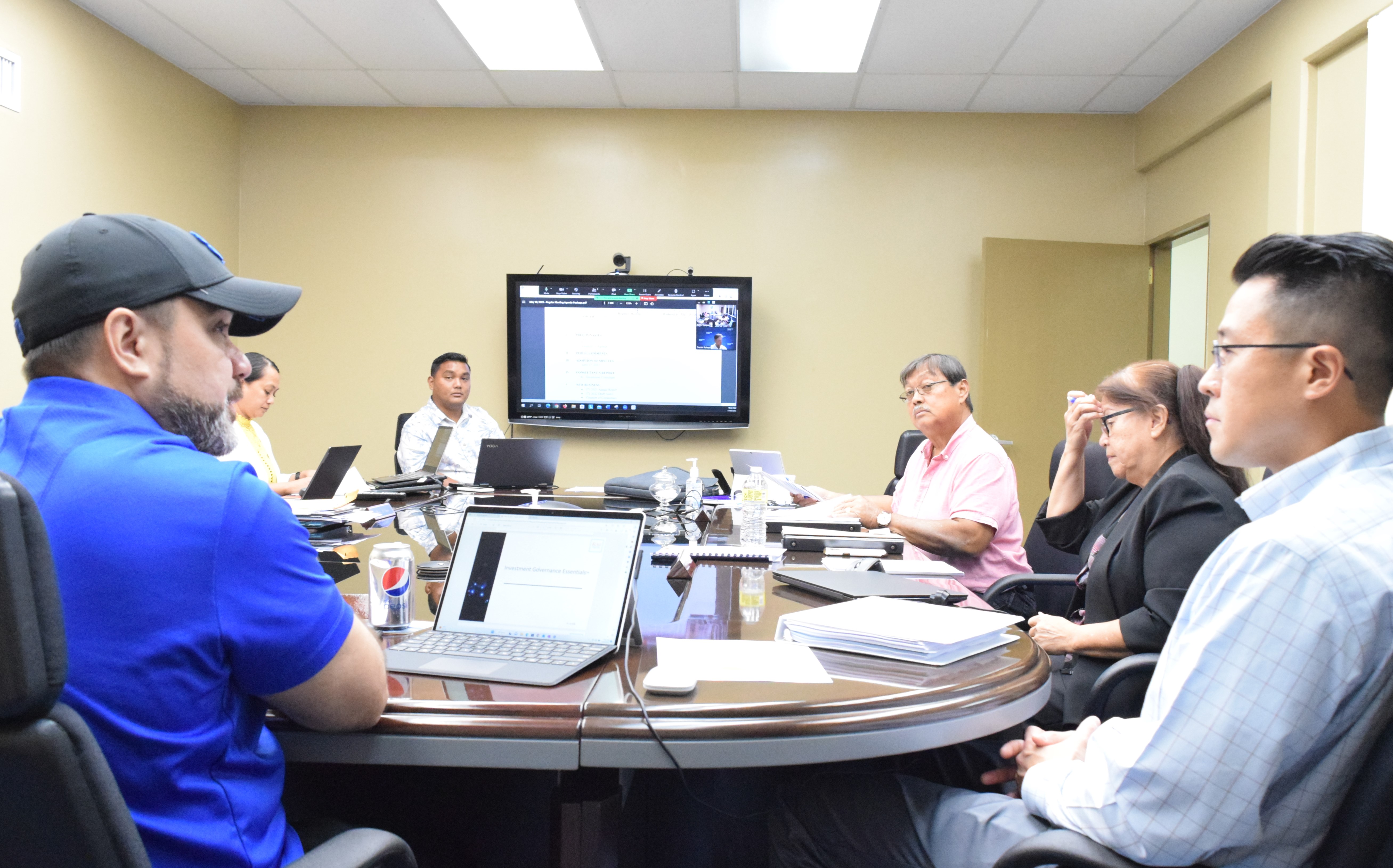 Marianas Public Land Trust Chairman Phillip Mendiola-Long left, speaks to Raymond James & Associates representative Jason Miyashita, right, as MPLT Vice Chair Dr. Rita A. Sablan, second right, board member Vianney Hocog third right, and Financial Officer Vinney Hocog third left, listen during a meeting on Wednesday last week on Capital Hill.