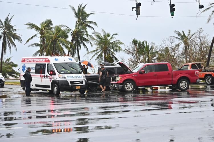 CRASH: An ambulance arrives at the scene of a crash at the Paseo Loop intersection in Hagåtña on Thursday. David Castro/The Guam Daily Post  