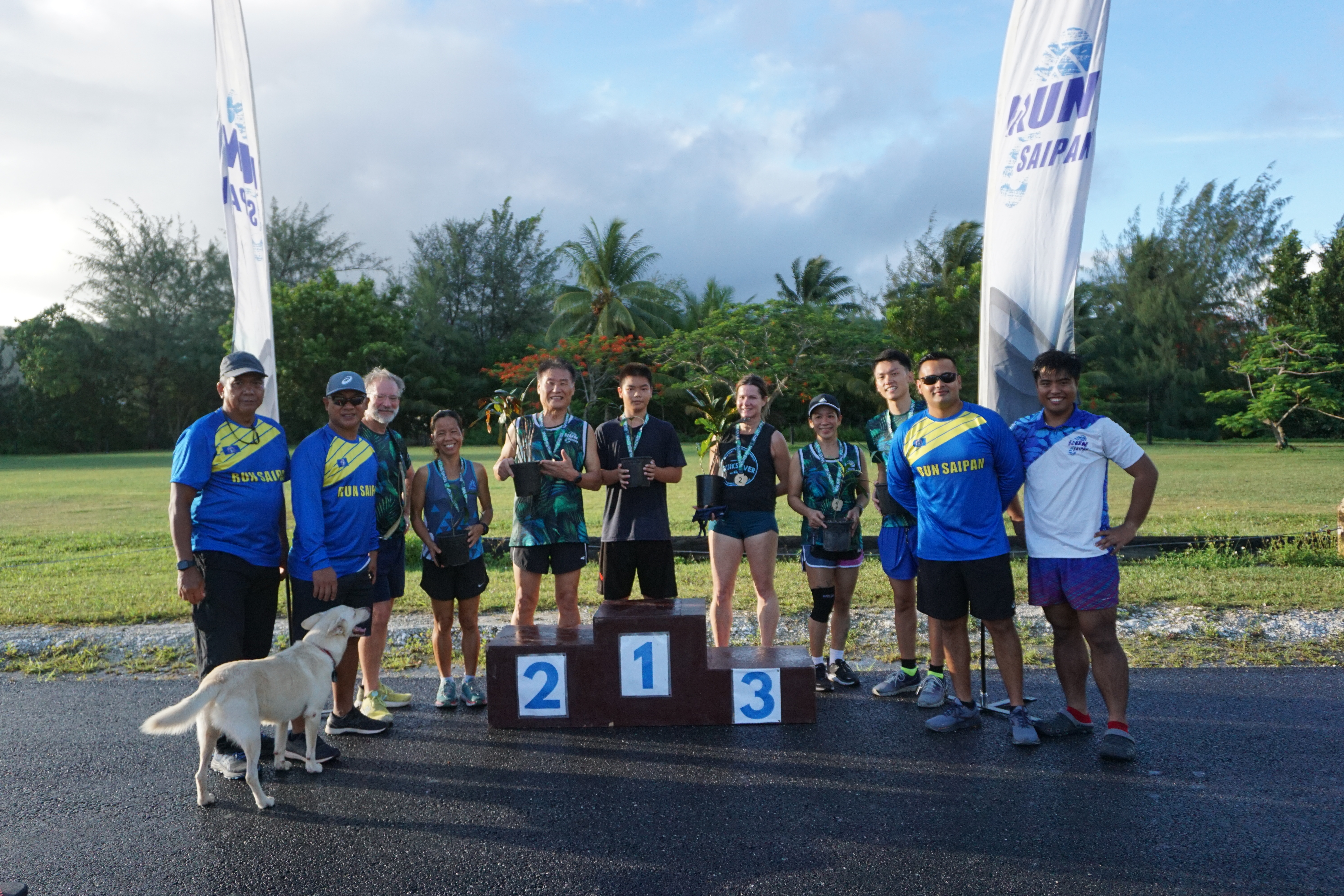The top three winners in the female and male divisions pose with Run Saipan officials during the awards ceremony of the Mangrove 5K Run at American Memorial Park.