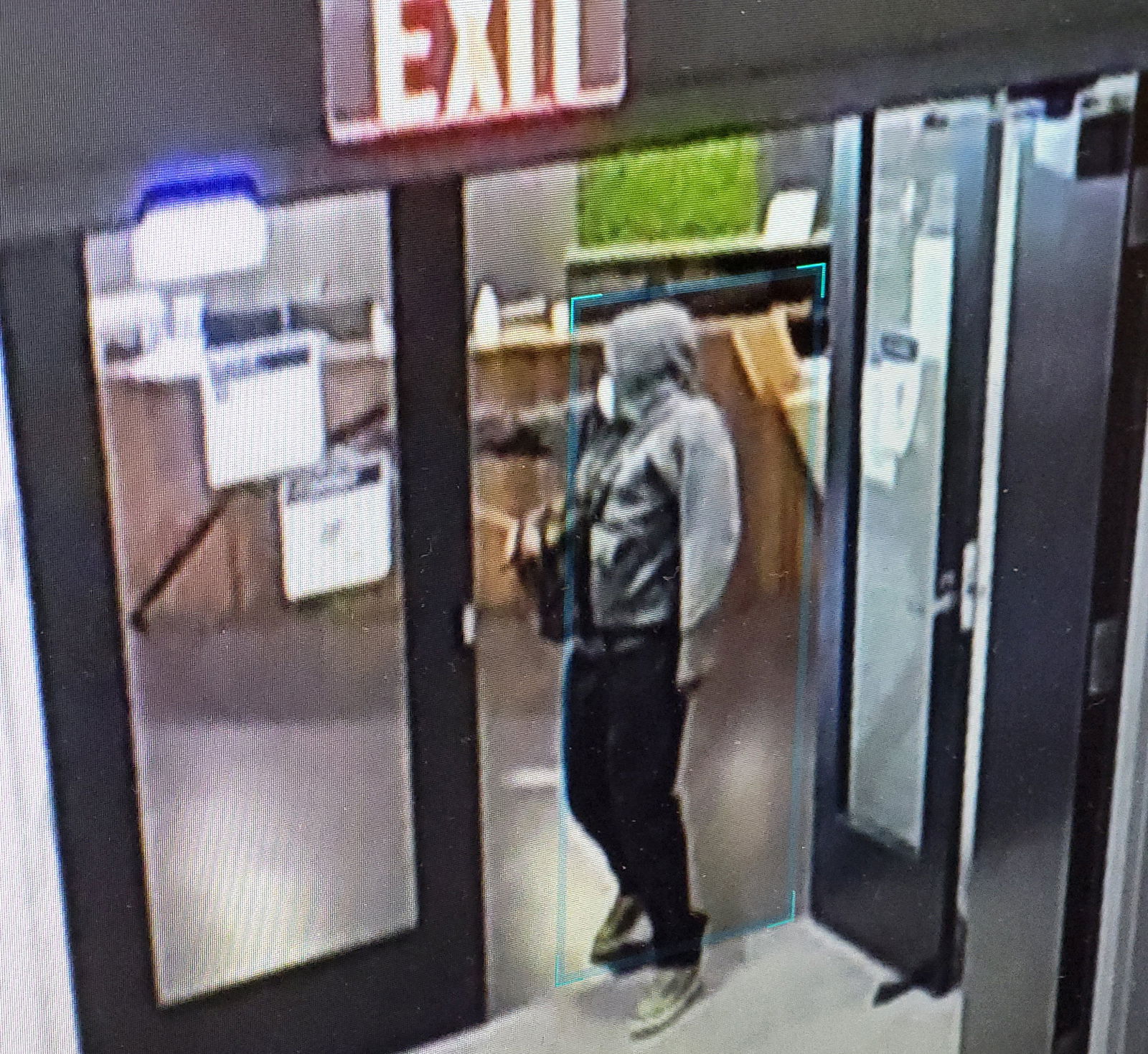 A man who Atlanta Police describe as a shooting suspect stands inside a hospital, in a still image from surveillance video in Atlanta, Georgia, U.S. May 3, 2023. Atlanta Police Department/Handout via REUTERS