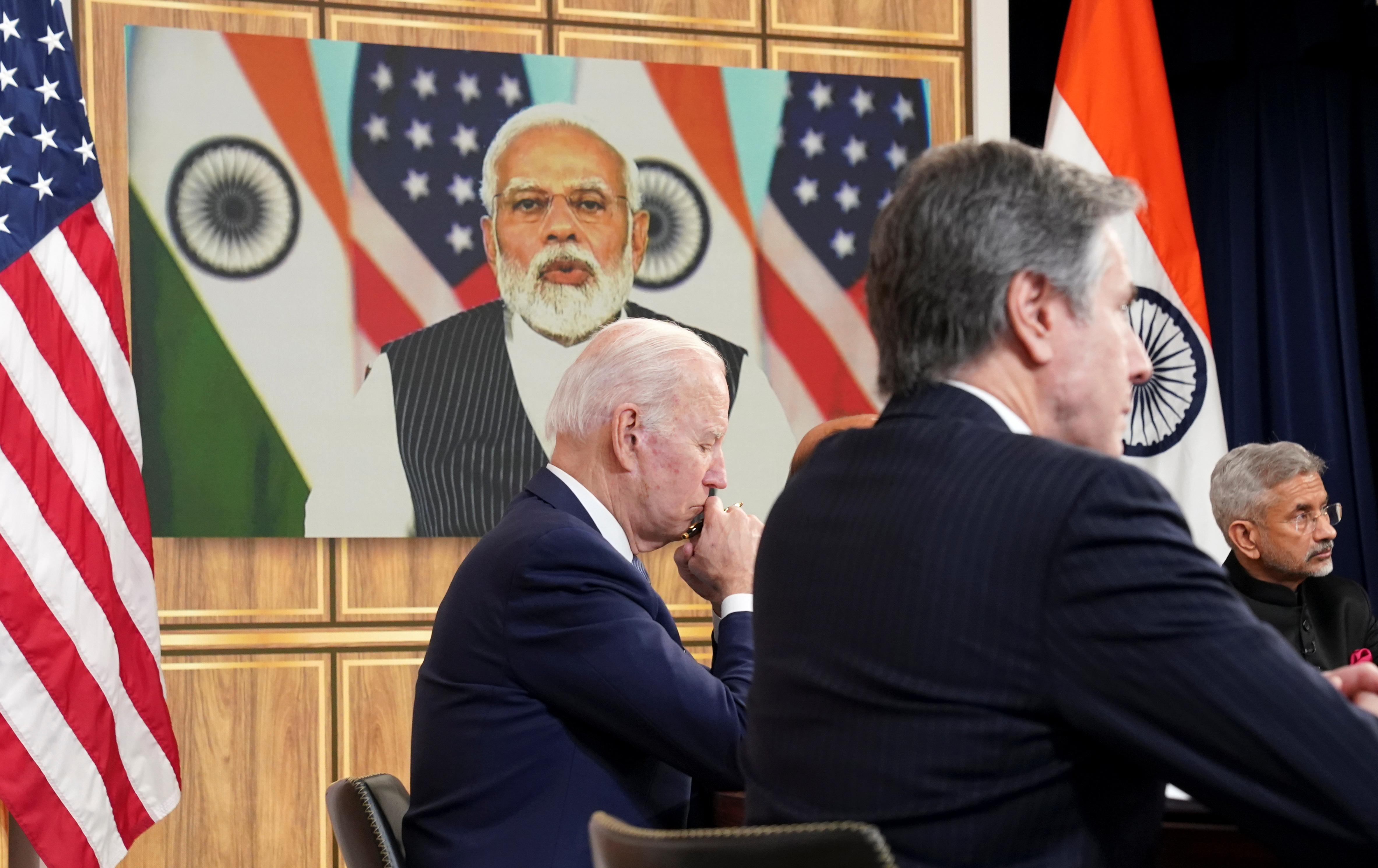 FILE PHOTO: U.S. President Joe Biden, seated with U.S. Secretary of State Antony Blinken and India's Foreign Minister Subrahmanyam Jaishankar, holds a videoconference with India's Prime Minister Narendra Modi to discuss Russia's war with Ukraine from the White House in Washington U.S., April 11, 2022. REUTERS/Kevin Lamarque