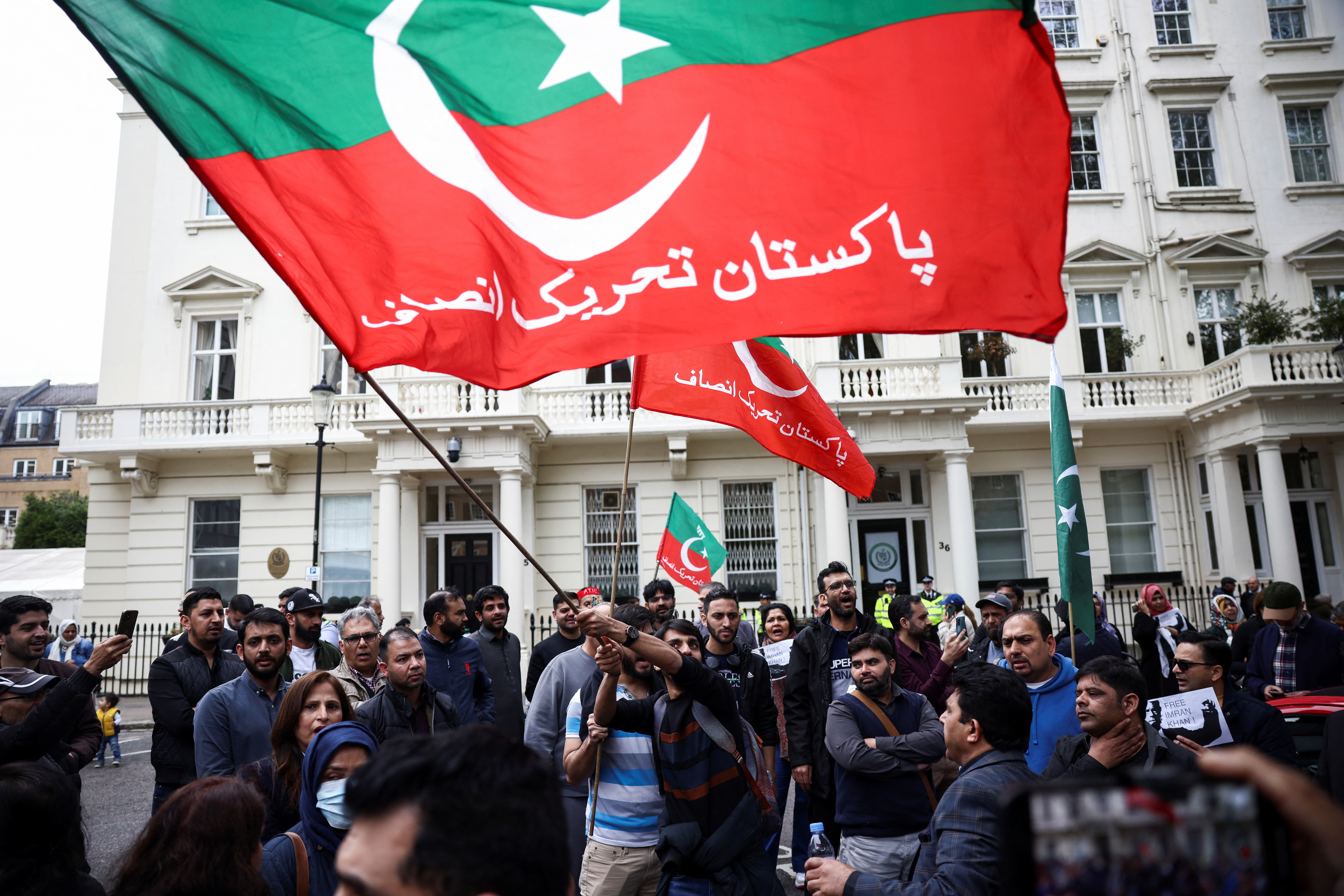 Supporters of Pakistan's former Prime Minister Imran Khan protest against his arrest in Pakistan, outside of the High Commission for Pakistan in London, Britain, May 9, 2023. REUTERS/Henry Nicholls