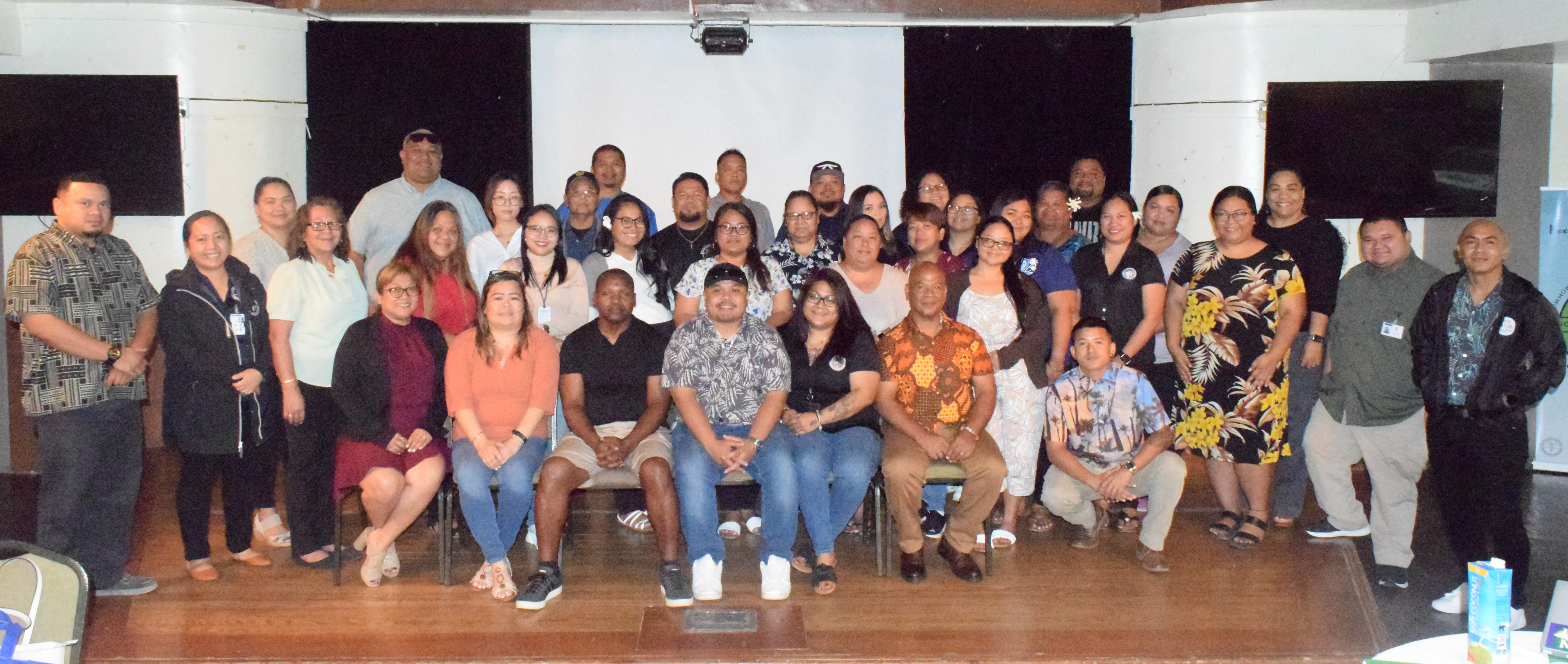 Behavioral Health Planning Council Chair Tai Doram, right seated, with other council officers and participants a workshop at the Pacific Islands Club's Charley’s Cabaret on Friday.