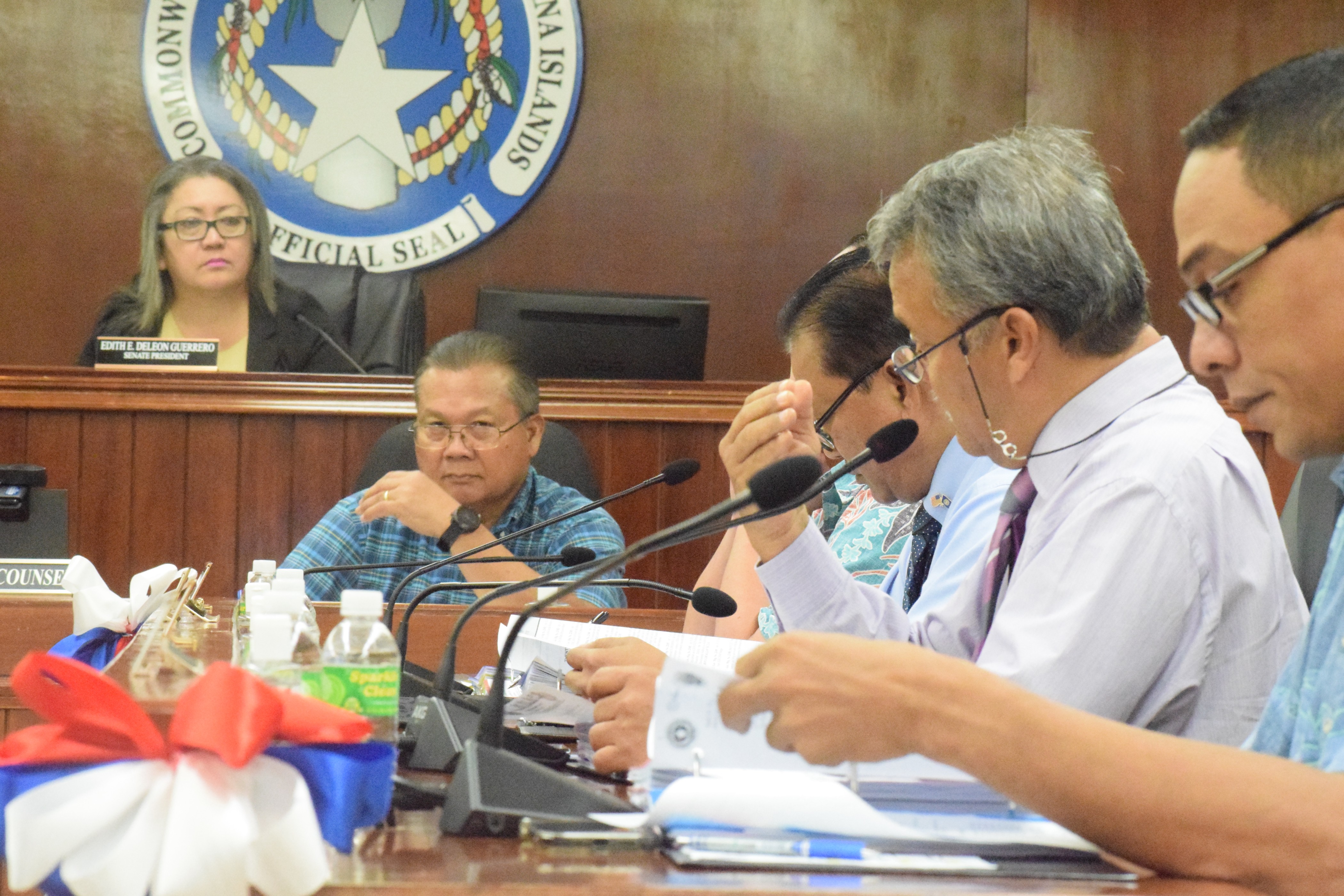 Sen. Paul A. Manglona, second right, gestures as he speaks during a Senate session on Tuesday.