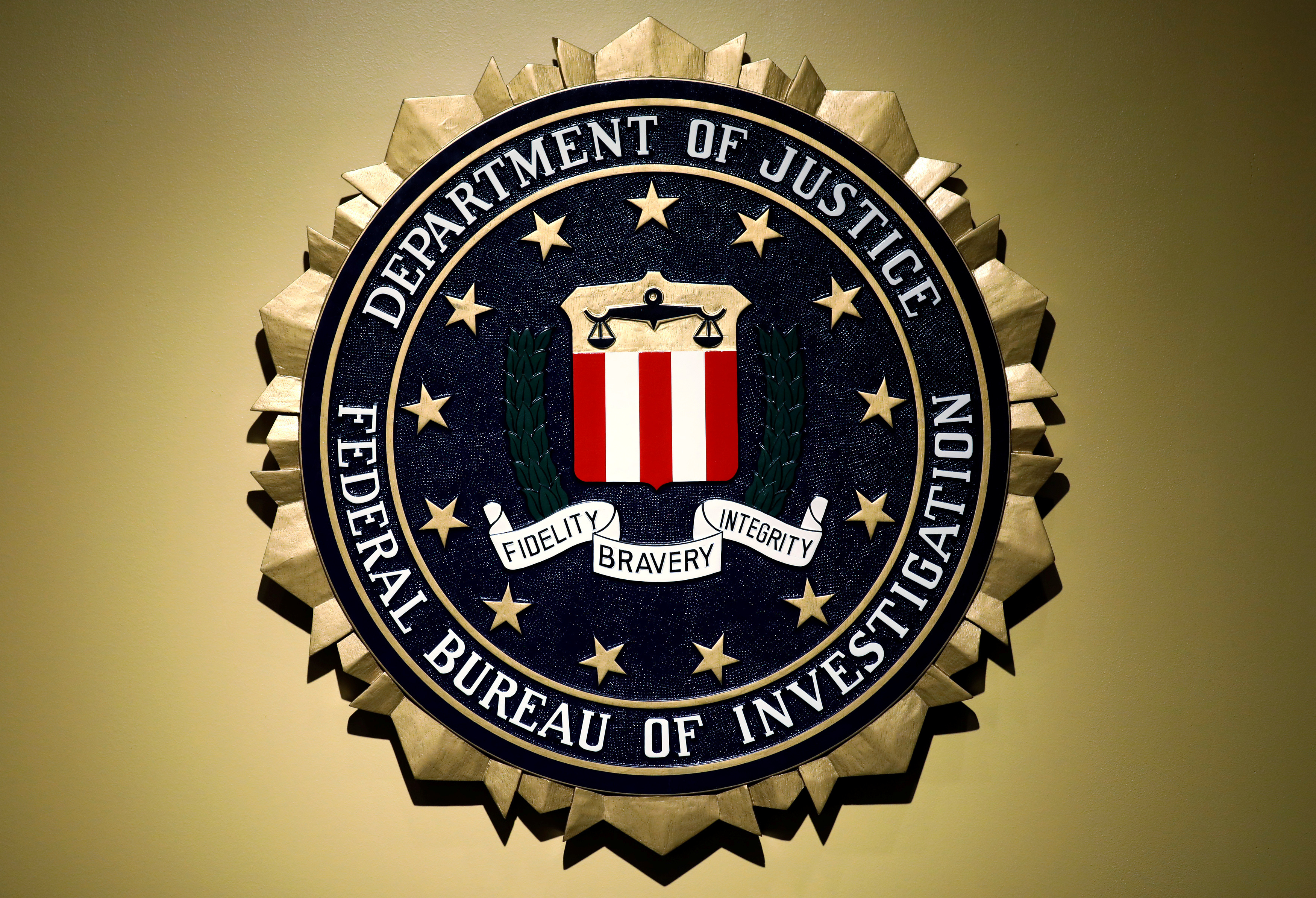 FILE PHOTO: The Federal Bureau of Investigation seal is seen at FBI headquarters before a news conference by FBI Director Christopher Wray on the U.S Justice Department's inspector general's report regarding the actions of the Federal Bureau of Investigation and the 2016 U.S. presidential election in Washington, U.S. June 14, 2018. REUTERS/Yuri Gripas