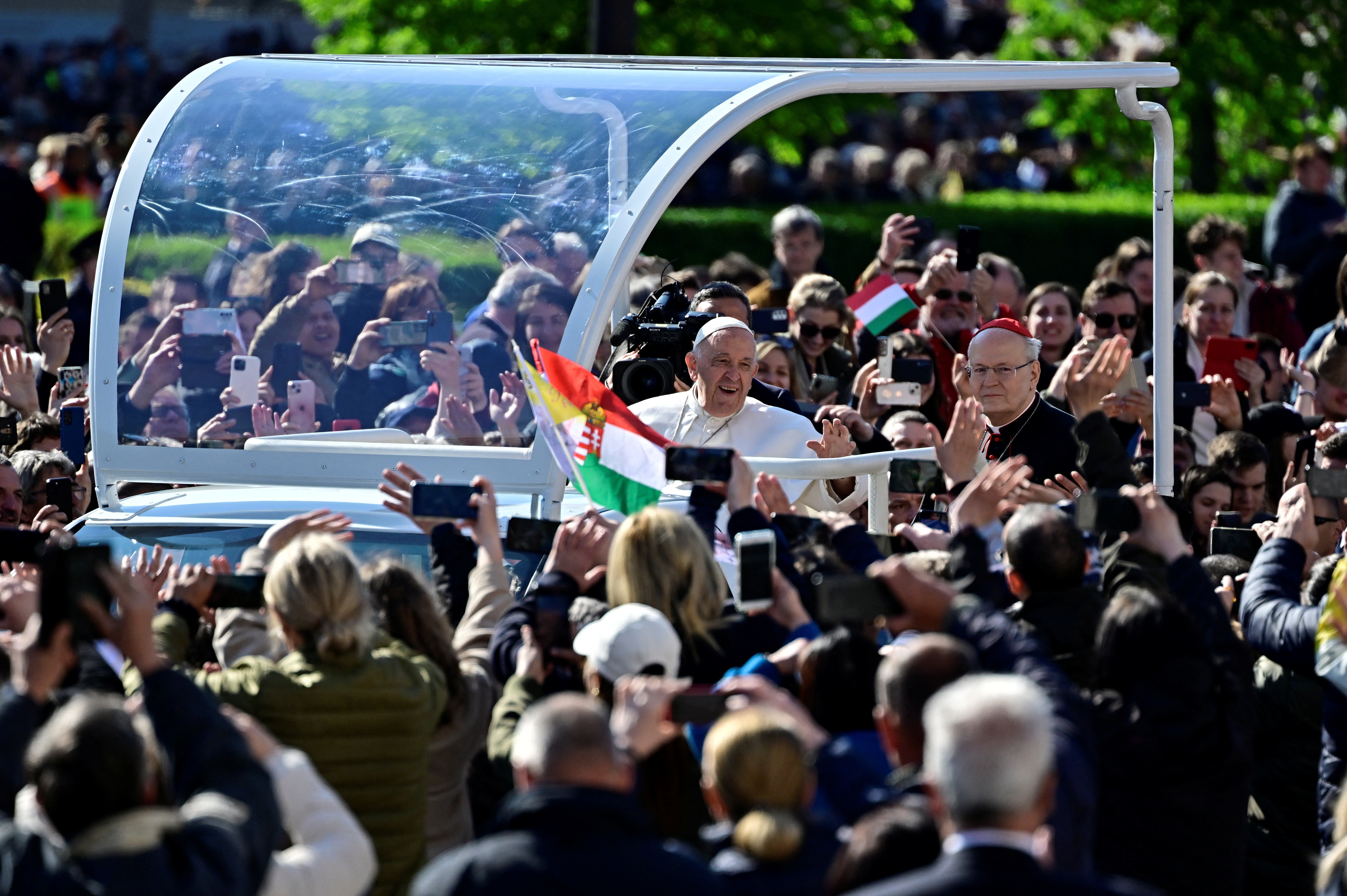 Pope Francis greets the crowd ahead of a holy mass at the Kossuth Lajos Square during his apostolic journey in Budapest, Hungary, April 30, 2023. REUTERS/Marton Monus