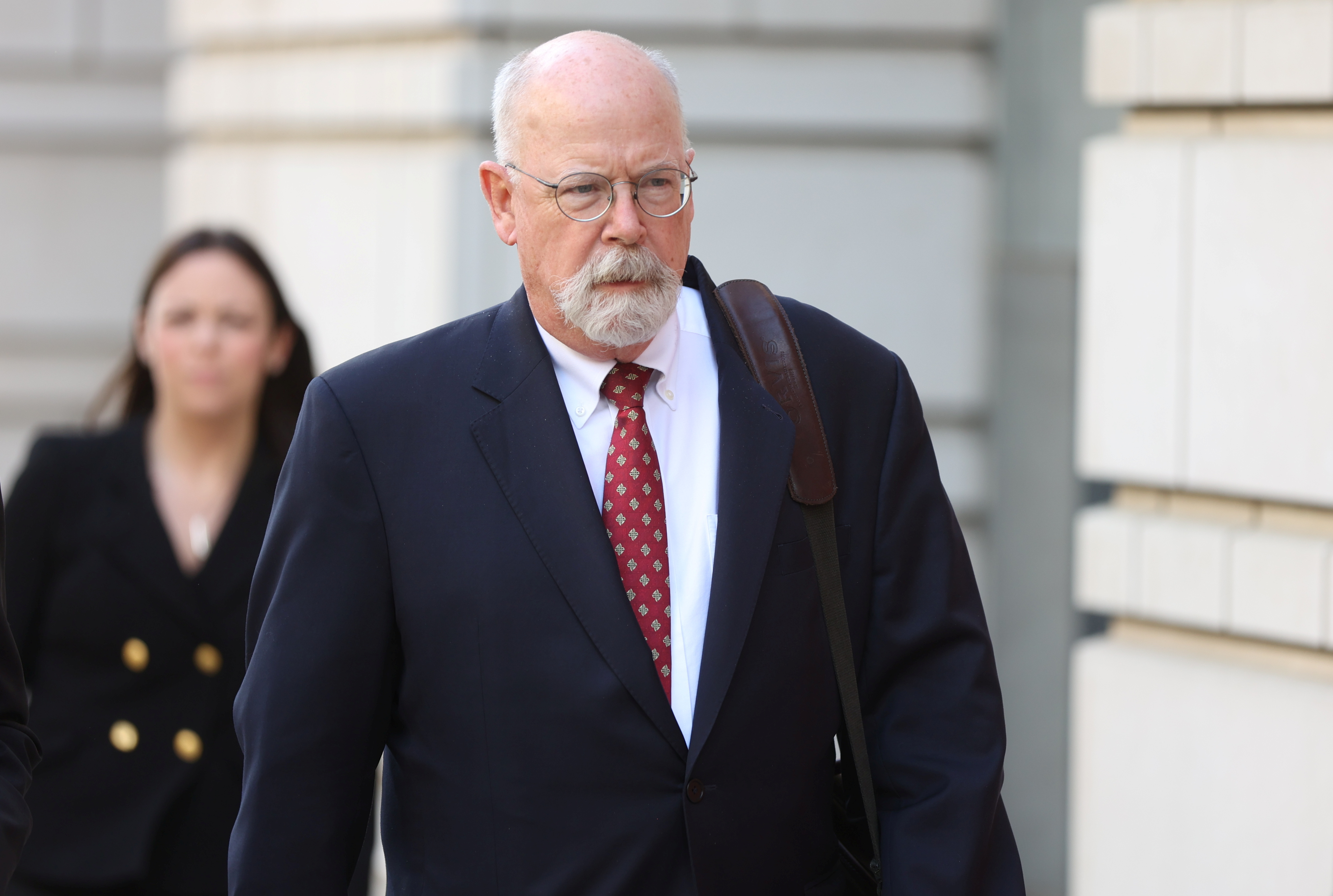 FILE PHOTO: Special Counsel John Durham departs the U.S. Federal Courthouse after opening arguments in the trial of Attorney Michael Sussmann, where Durham is prosecuting Sussmann on charges that Sussmann lied to the Federal Bureau of Investigation (FBI) while providing information about later discredited allegations of communications between the 2016 presidential campaign of former U.S. President Donald Trump and Russia, in Washington, U.S. May 17, 2022. REUTERS/Julia Nikhinson