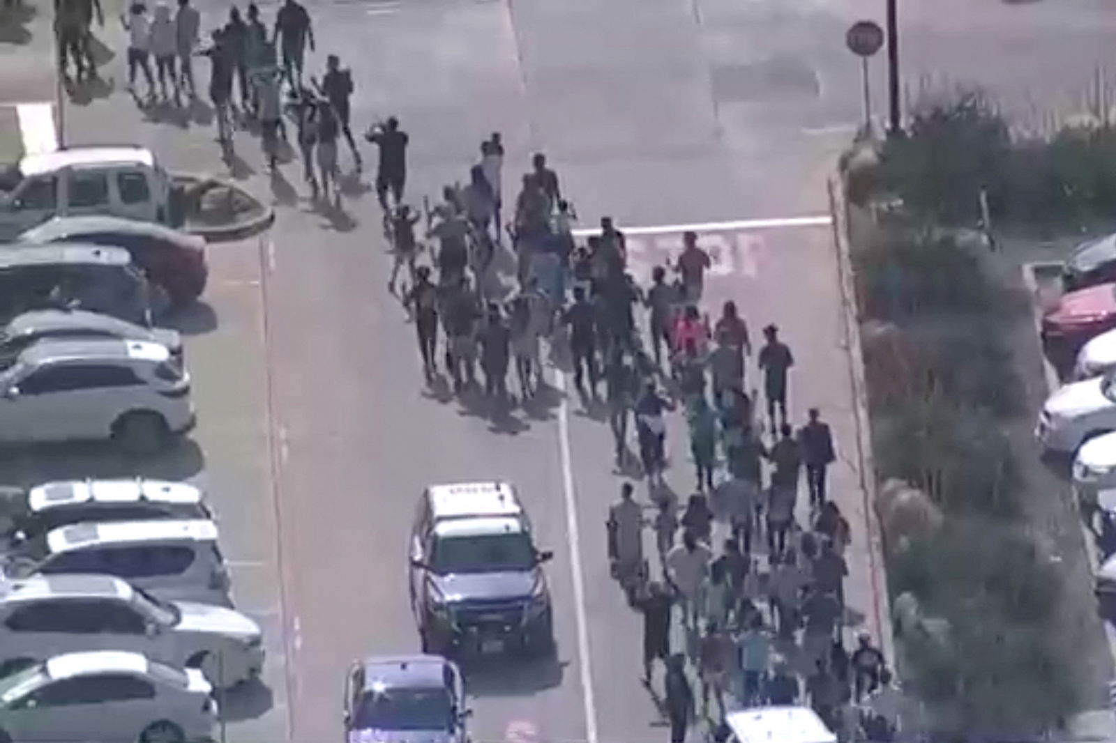 Shoppers leave as police respond to a shooting in the Dallas area's Allen Premium Outlets, which authorities said has left multiple people injured in Allen, Texas, U.S. May 6, 2023 in a still image from video. ABC Affiliate WFAA via REUTERS