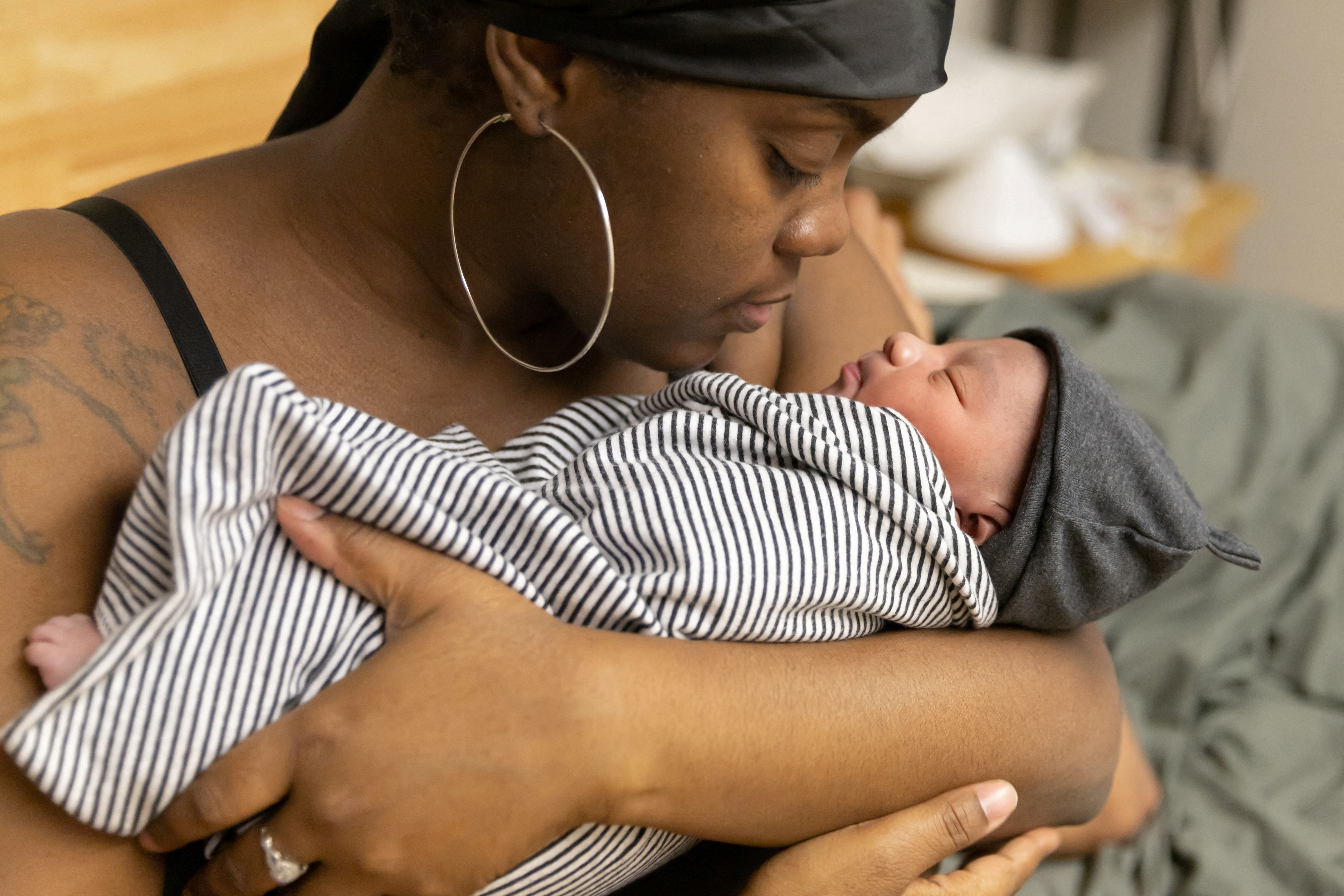 Medical assistant Lakayla Sobers, 31, holds her newborn son Alfonso Jr a few hours after giving birth, in a birthing center Brooklyn, New York, U.S., February 8, 2023. REUTERS/Joy Malone