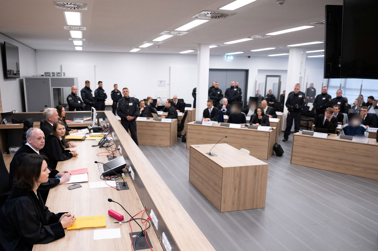 Defendants sit next to their lawyers in the courtroom of the Higher Regional Court before the verdict over a jewellery heist on the Green Vault museum in Dresden's Royal Palace, in Dresden, Germany on May 16, 2023. Sebastian Kahnert/Pool via REUTERS