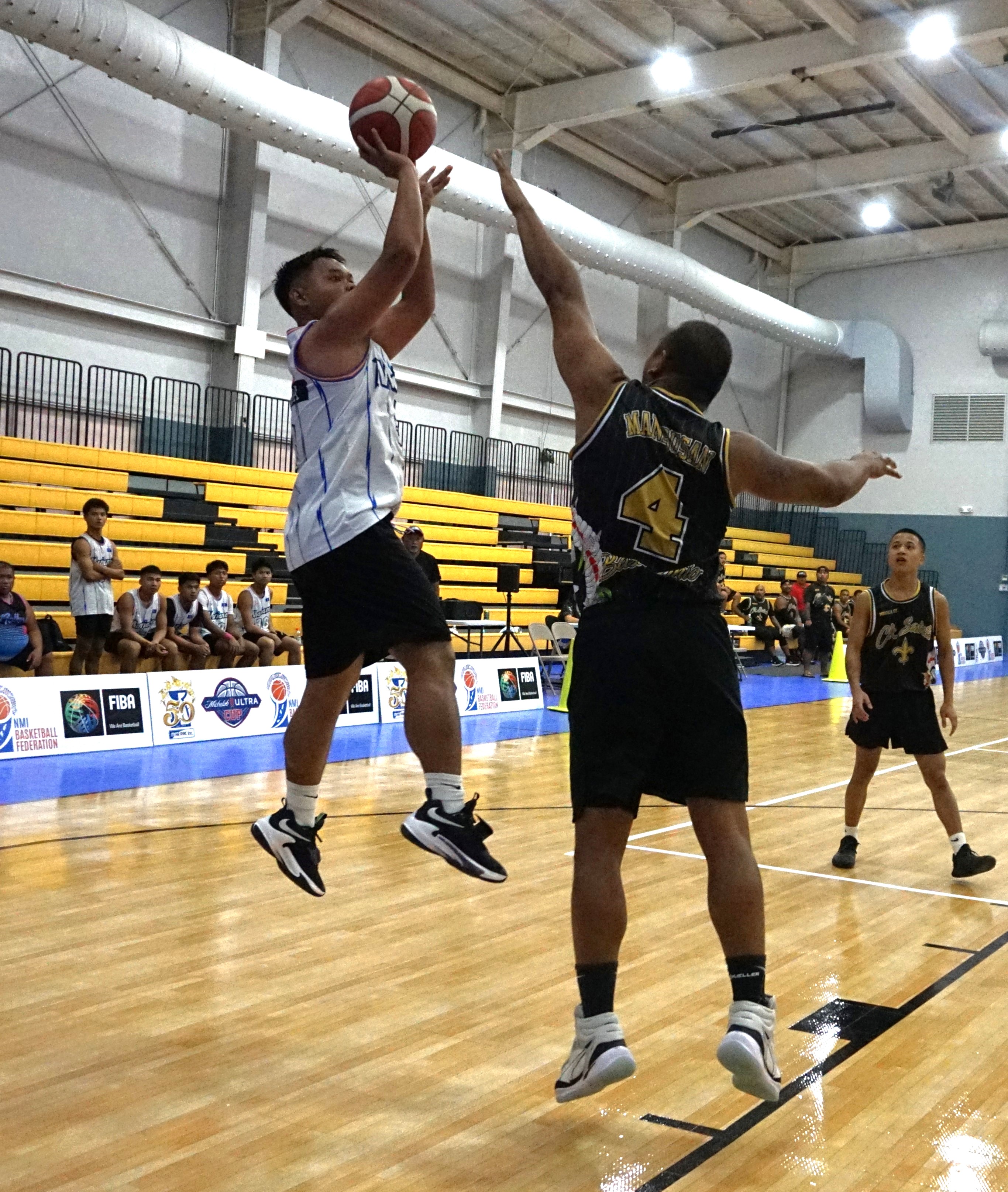 Team Marianas' Jack Aranda pulls up for the fadeaway shot against the CK Saints in a Michelob Ultra Cup game at the Ada gym.