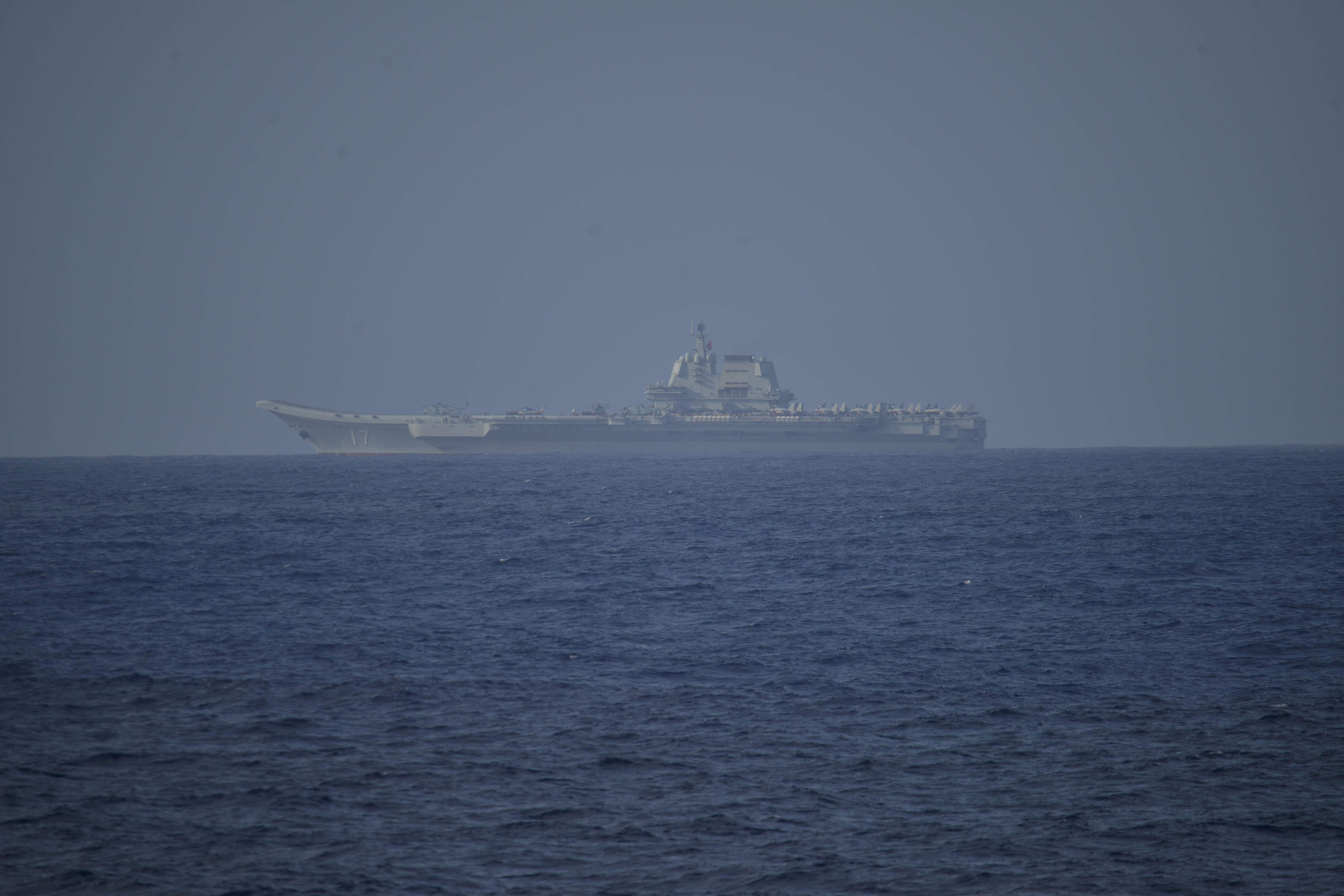 FILE PHOTO: Chinese aircraft carrier Shandong sails in Pacific Ocean waters, about 300 kms (186 miles) south of Okinawa prefecture, Japan, in this handout image taken by Japan Self-Defense Force on April 5, 2023 and released by the Joint Staff Office of the Defense Ministry of Japan April 6, 2023. Joint Staff Office of the Defense Ministry of Japan/HANDOUT via REUTERS