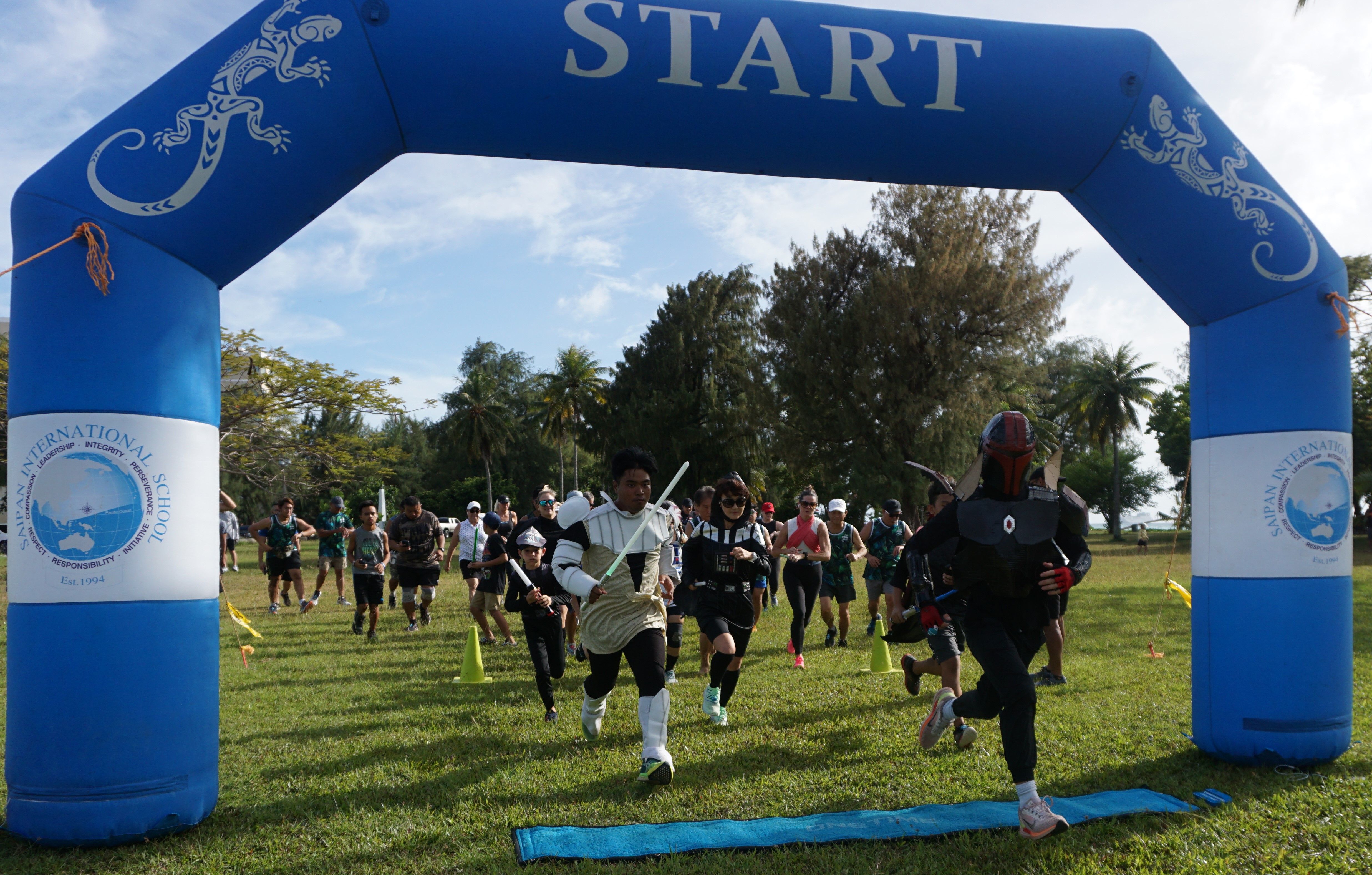Participants of SIS & Run Saipan’s 3rd Annual Star Wars Day run take off at the starting point.