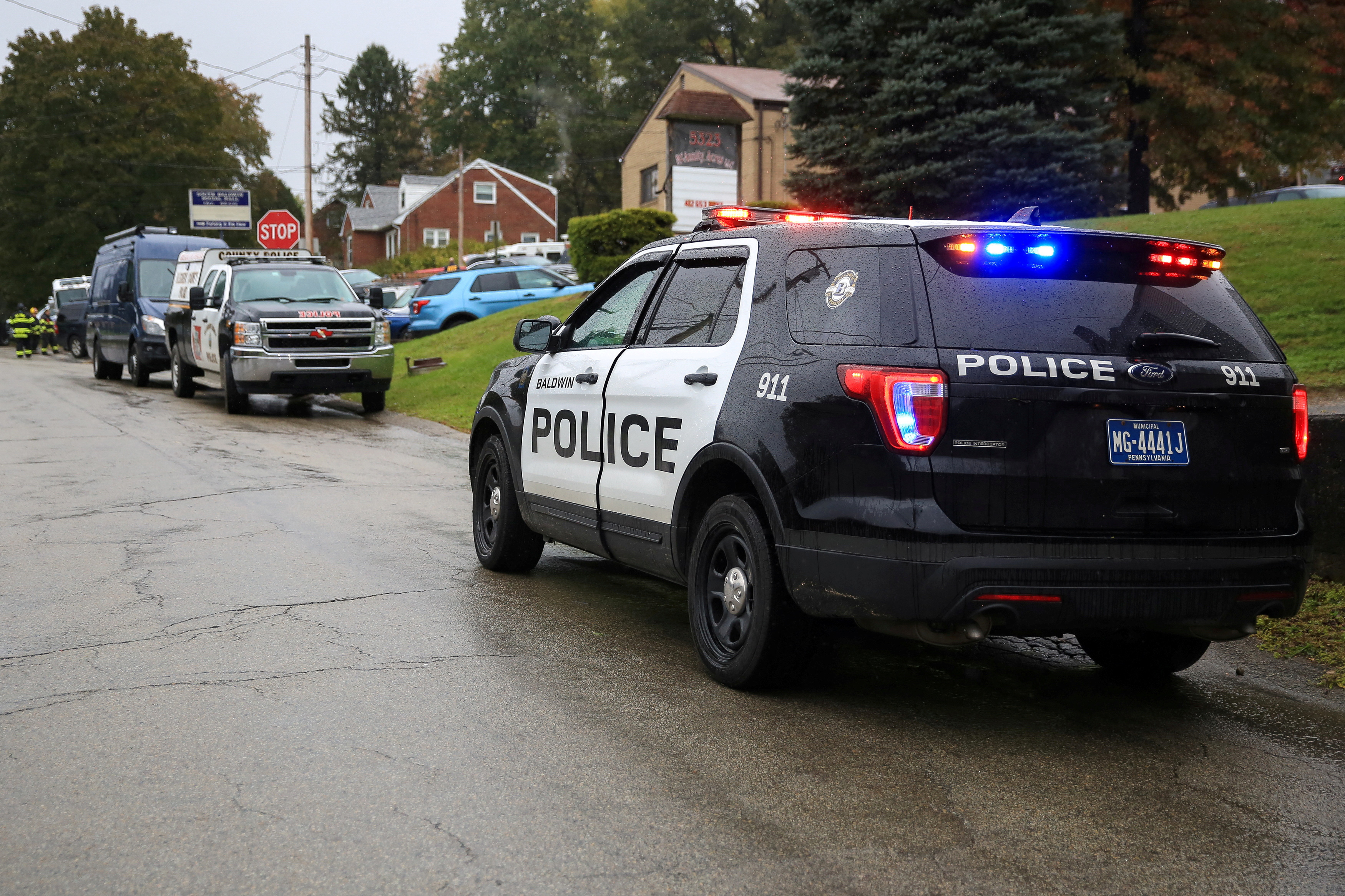 FILE PHOTO: Police vehicles are deployed near the vicinity of the home of Pittsburgh synagogue shooting suspect Robert Bowers' home in Baldwin borough, suburb of Pittsburgh, Pennsylvania, U.S., October 27, 2018. REUTERS/John Altdorfer/File Photo