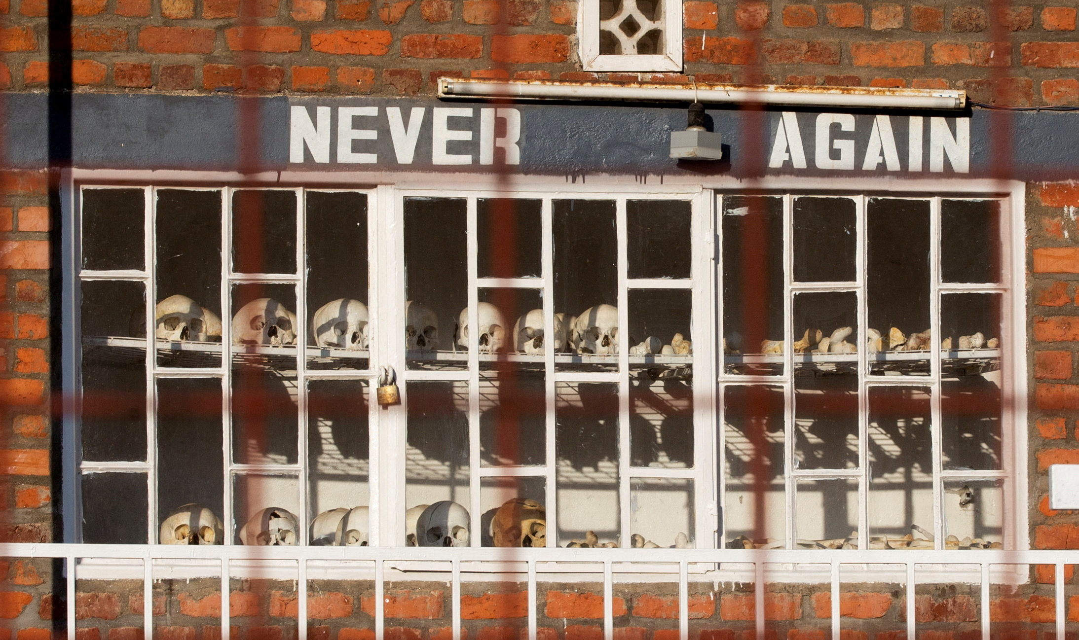 Skulls of people who died during the 1994 Rwandan genocide are arranged and locked outside the St. Pierre Catholic Church, in Kibuye, Karongo city center, Karongi district South West of Rwanda May 26, 2023. REUTERS/Jean Bizimana