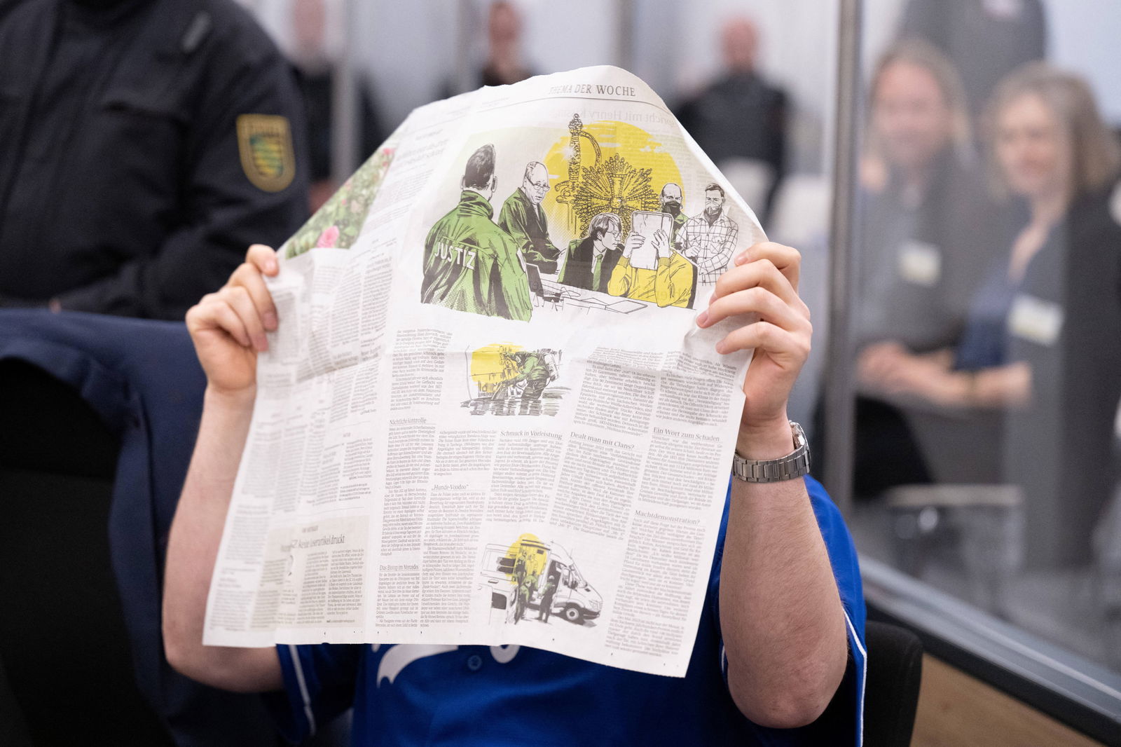 A defendant hides his face in the courtroom of the Higher Regional Court before the verdict over a jewellery heist on the Green Vault museum in Dresden's Royal Palace, in Dresden, Germany on May 16, 2023. Sebastian Kahnert/Pool via REUTERS