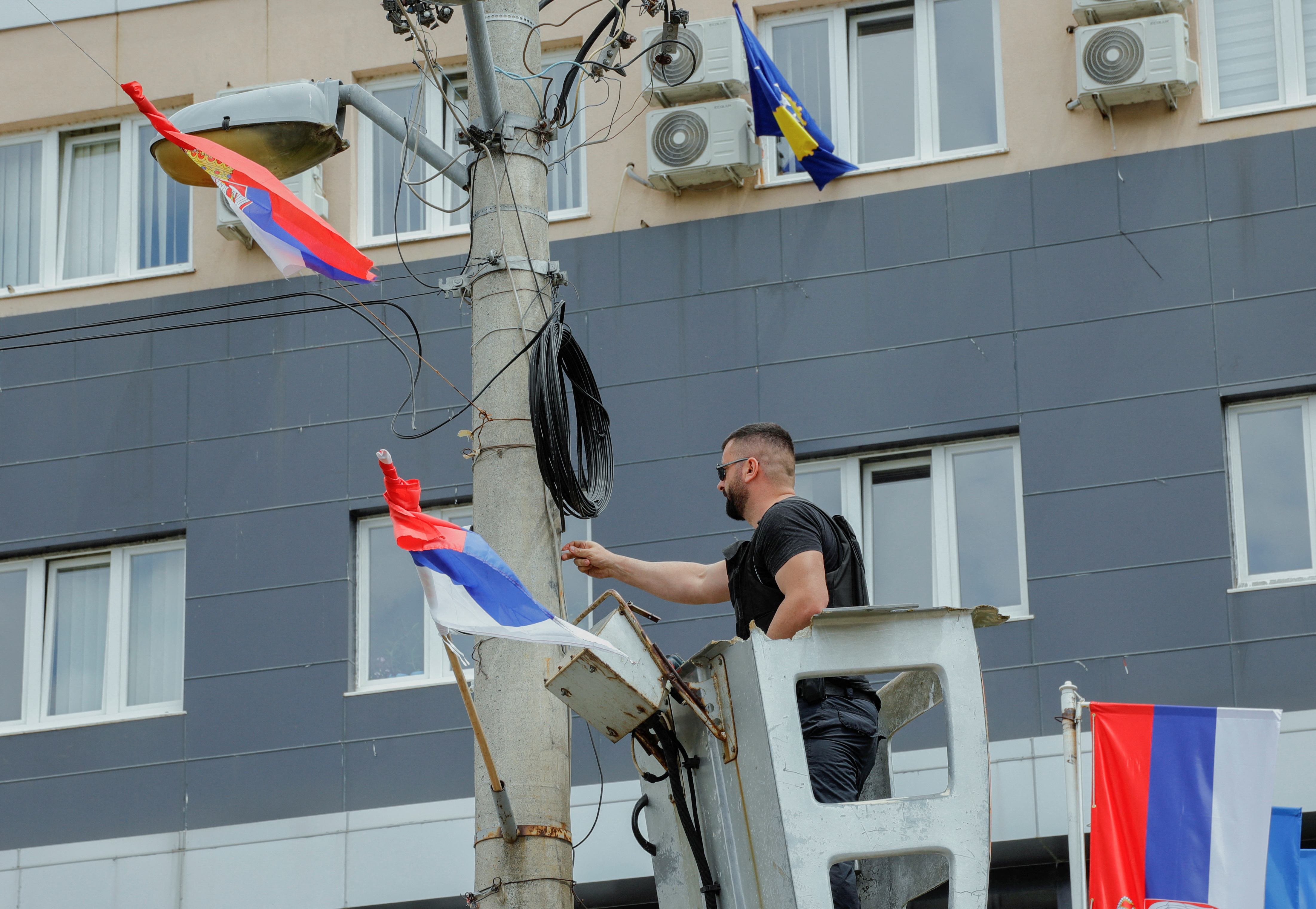 Kosovo special police forces replace video surveillance at the municipal offices, after Serb protestors prevent a newly elected ethnic Albanian mayor from entering the office in Zvecan, in Leposavic, Kosovo, May 27, 2023.REUTERS/Ognen Teofilovski