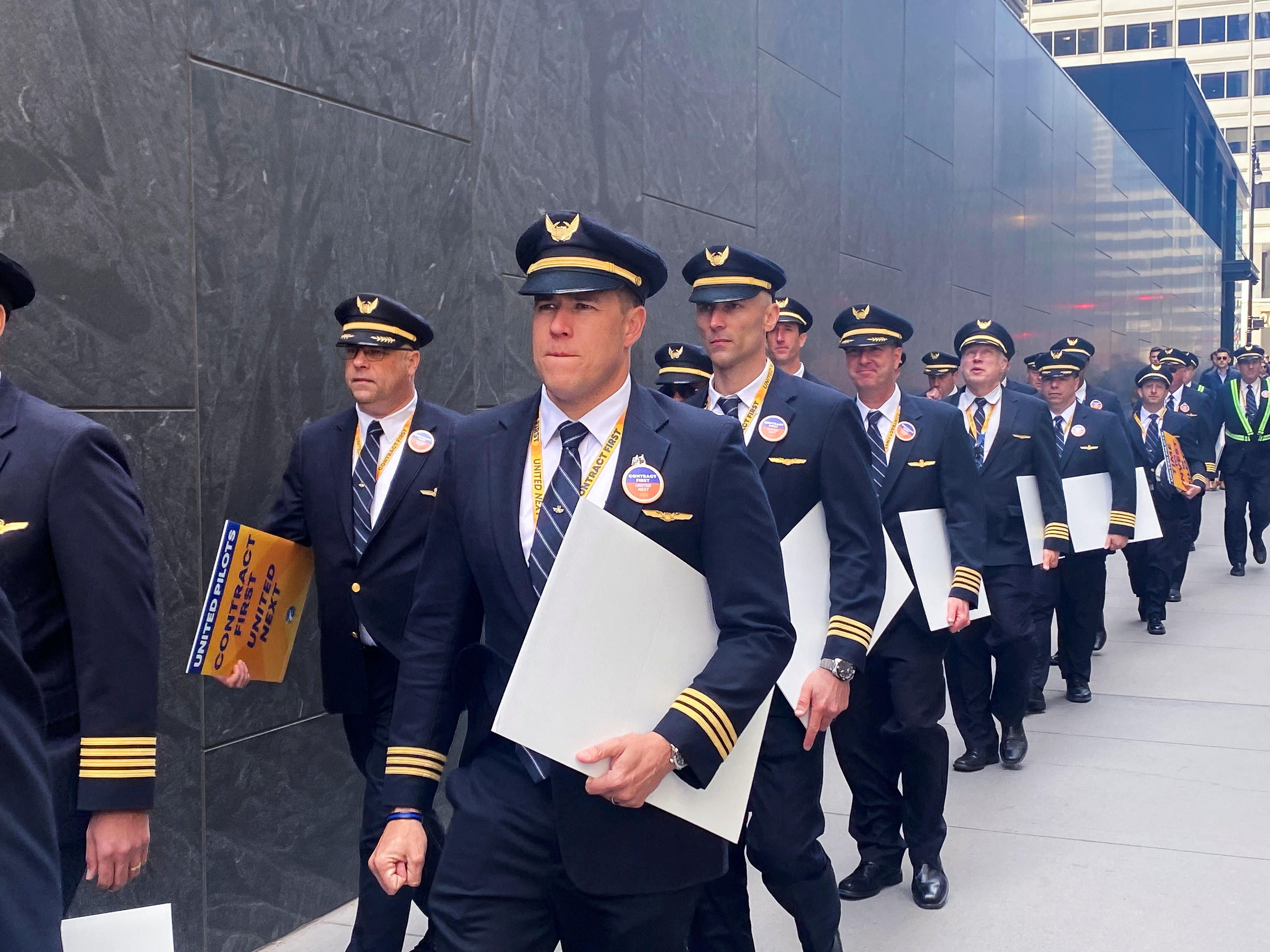 FILE PHOTO: United Airlines pilots protest for a new contract in downtown Chicago, Illinois, U.S, April 19, 2023. REUTERS/Caroline Stauffer