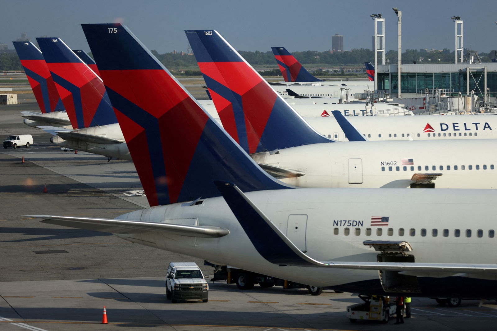 FILE PHOTO: Delta Air Lines planes are seen at John F. Kennedy International Airport on the July 4th weekend in Queens, New York City, U.S., July 2, 2022. REUTERS/Andrew Kelly