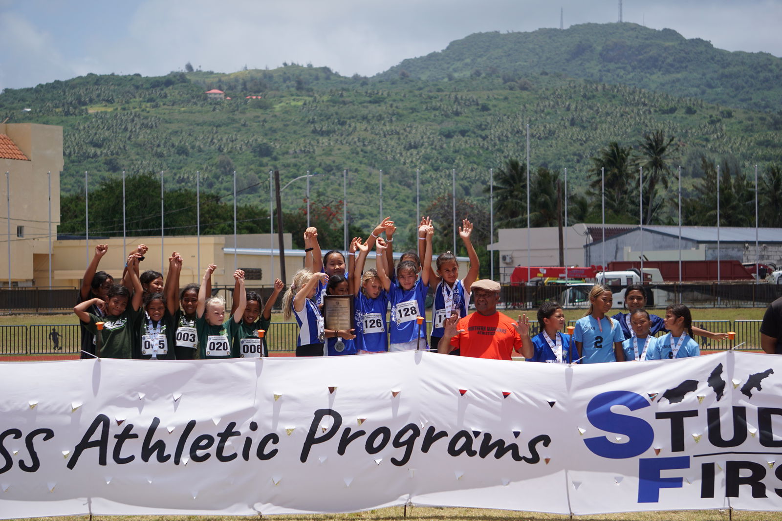 The young athletes of Saipan International School, Oleai Elementary School and Tinian Elementary School pose for a photo during the U9 & U12 girls division awards ceremony of the PSS-McDonalds All School Athletics Championships at the Oleai Sports Complex on Saturday.