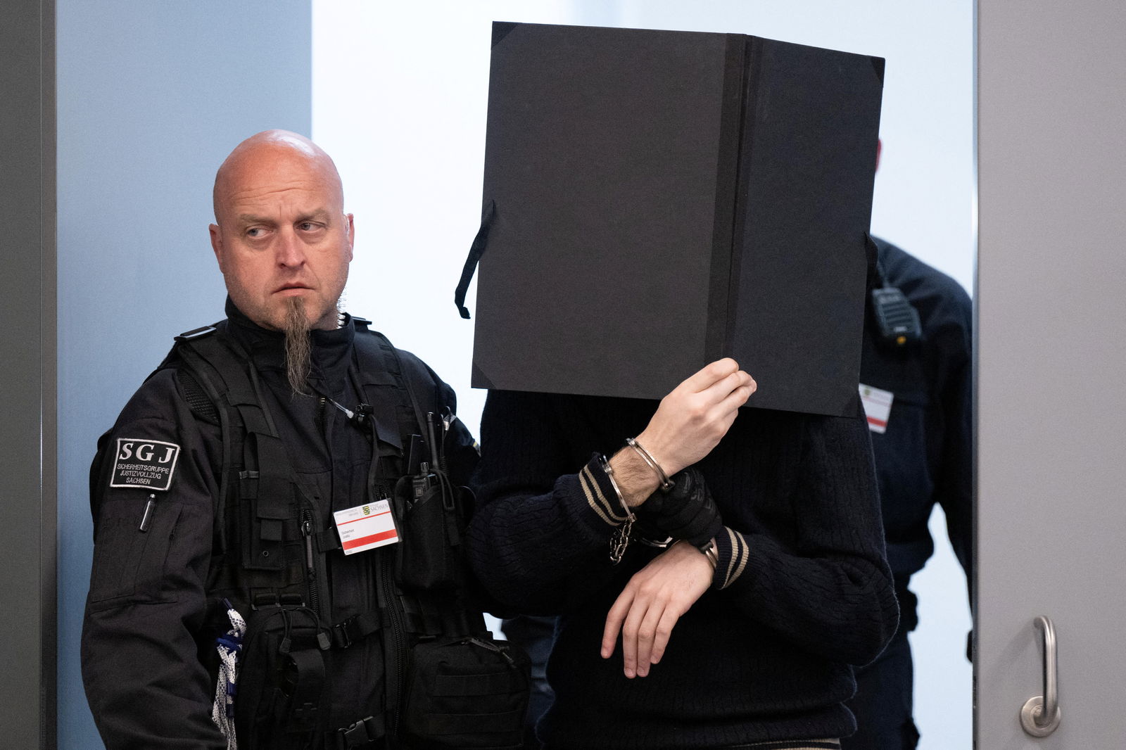 A defendant arrives in the courtroom of the Higher Regional Court before the verdict over a jewellery heist on the Green Vault museum in Dresden's Royal Palace, in Dresden, Germany on May 16, 2023. Sebastian Kahnert/Pool via REUTERS