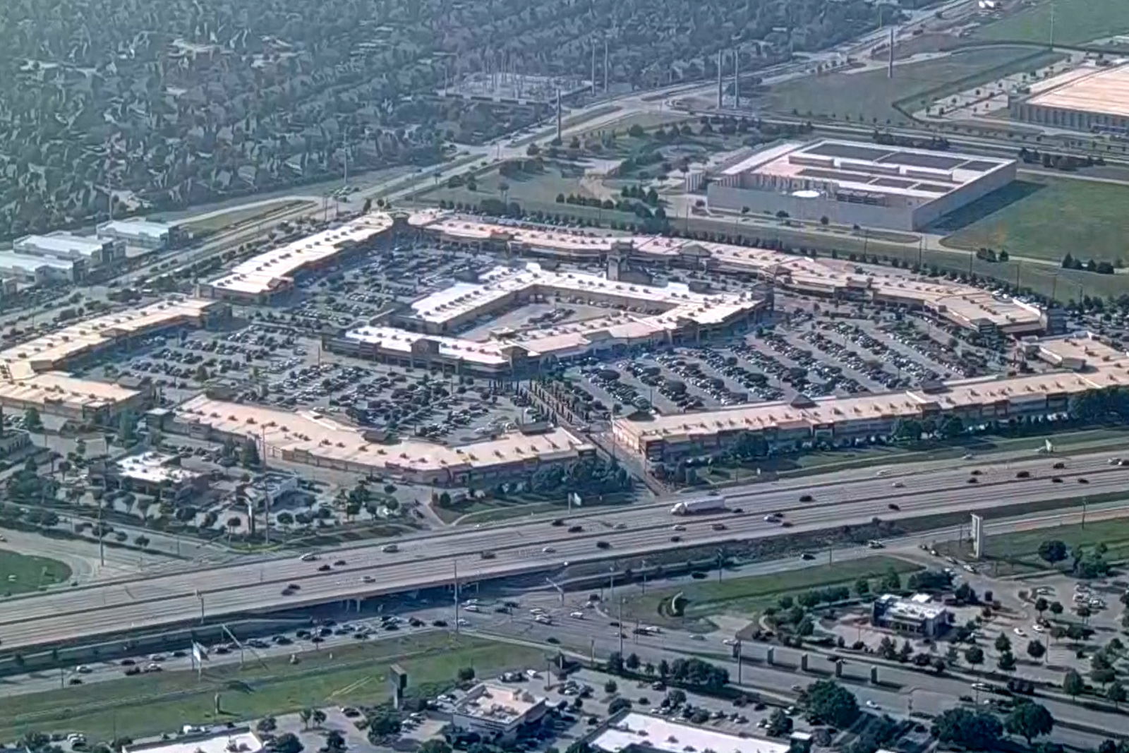 An aerial view of the Dallas area's Allen Premium Outlets, where authorities said a shooting left multiple people injured in Allen, Texas, U.S. May 6, 2023 in a still image from video. ABC Affiliate WFAA via REUTERS