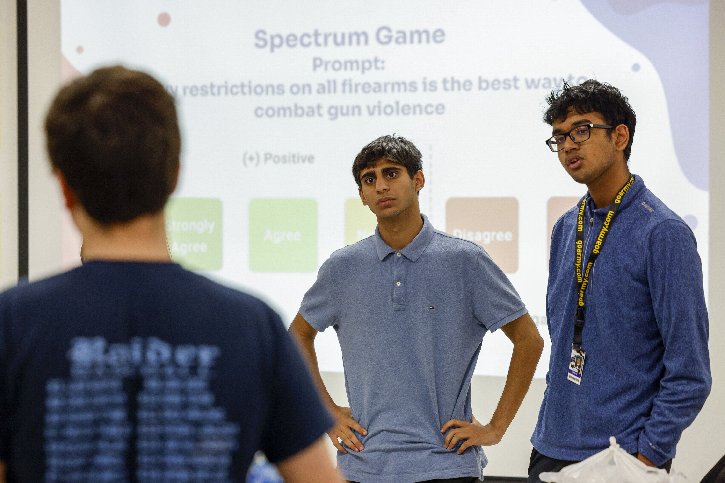 Rizwan Khan, founder and executive director (center), and Harshith Amaram, co-founder and director of expansion (right), listen to a fellow student voice his opinion about ways to combat gun violence during a Politics for Teens meeting at Plano West Senior High School on Thursday, May 18, 2023, in Plano, Texas. (ElÃ­as Valverde II/The Dallas Morning News/TNS)