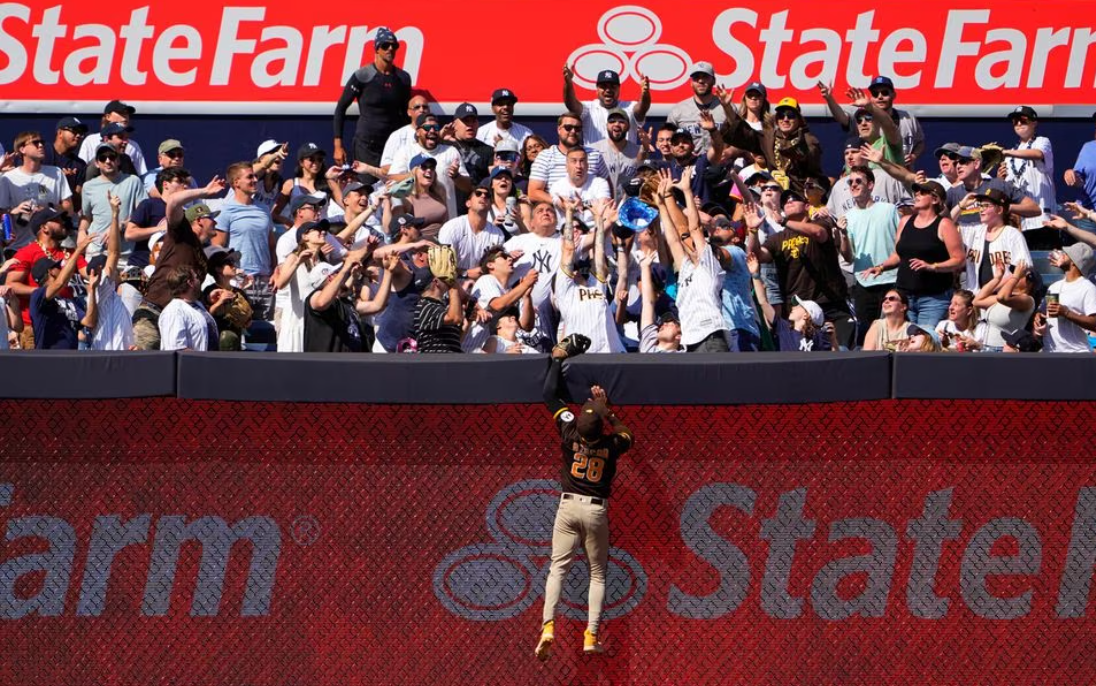 San Diego Padres right fielder Jose Azocar (28) leaps for New York Yankees center fielder Harrison Bader’s (22) home run during the eighth inning at Yankee Stadium in the Bronx, New York, May 28, 2023.